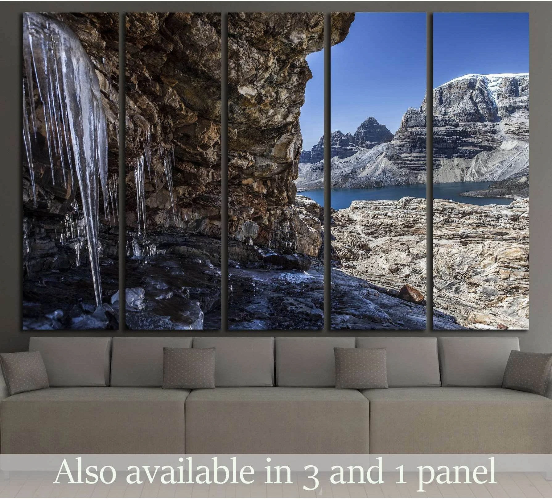 Andes ice cave canvas print with icicles, alpine lake, and snowy peaks above a living room sofa