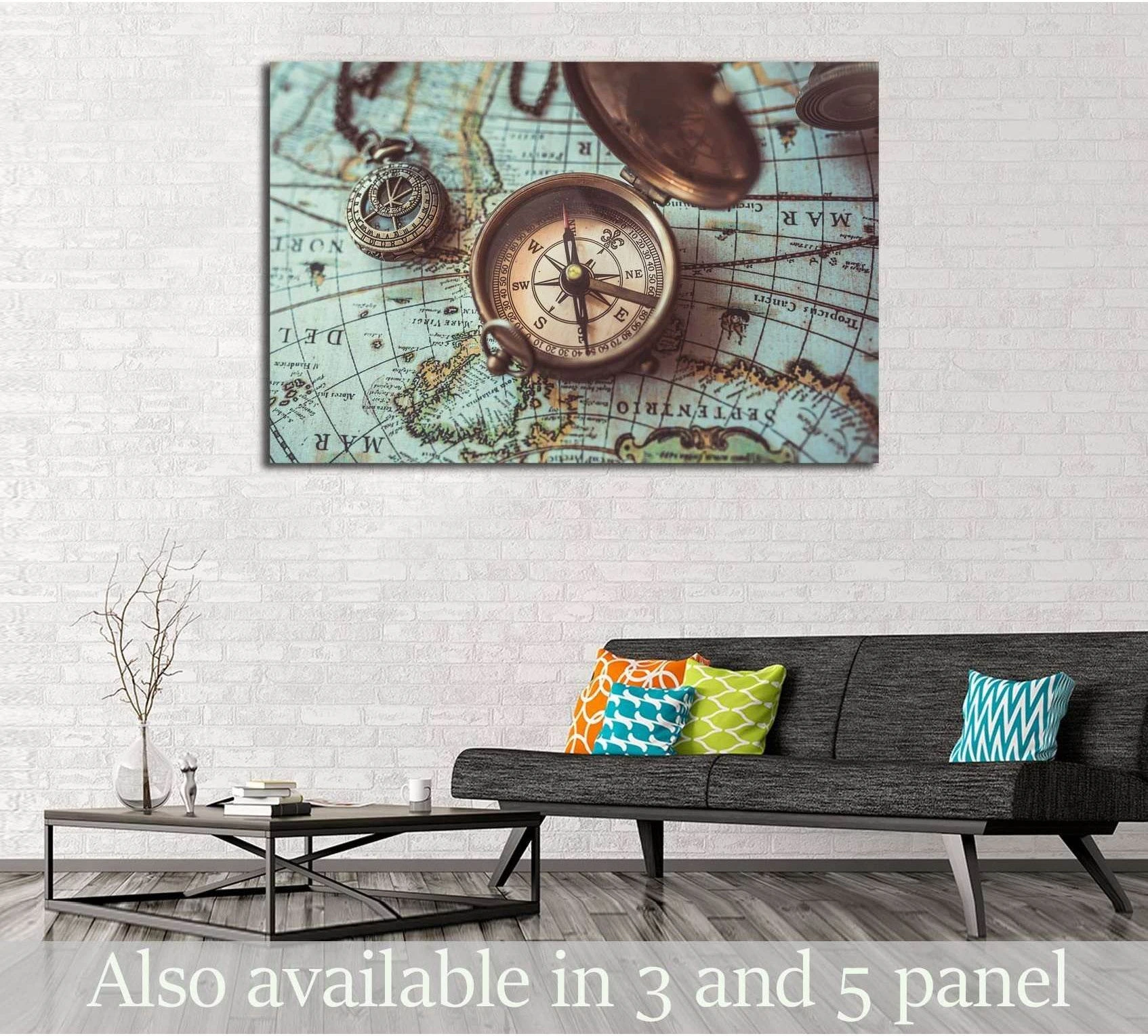Vintage compass canvas print on an old world map, displayed above a sofa in a modern living room