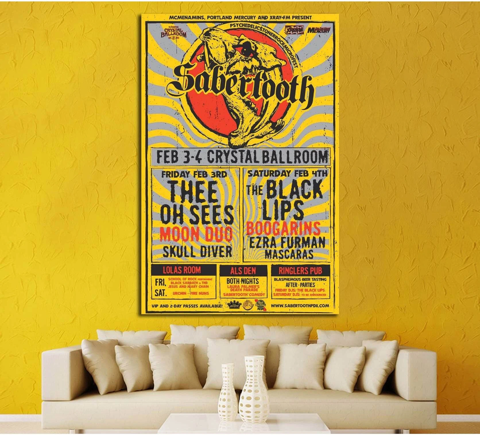 Vintage Sabertooth concert poster canvas print above sofa in a yellow modern living room