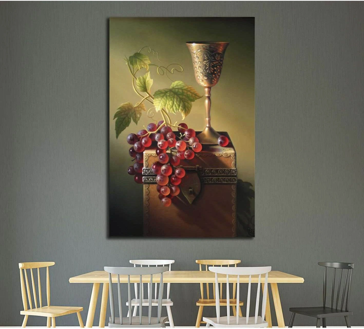 Classic still life canvas print with red grapes, ornate goblet, and antique chest above dining table
