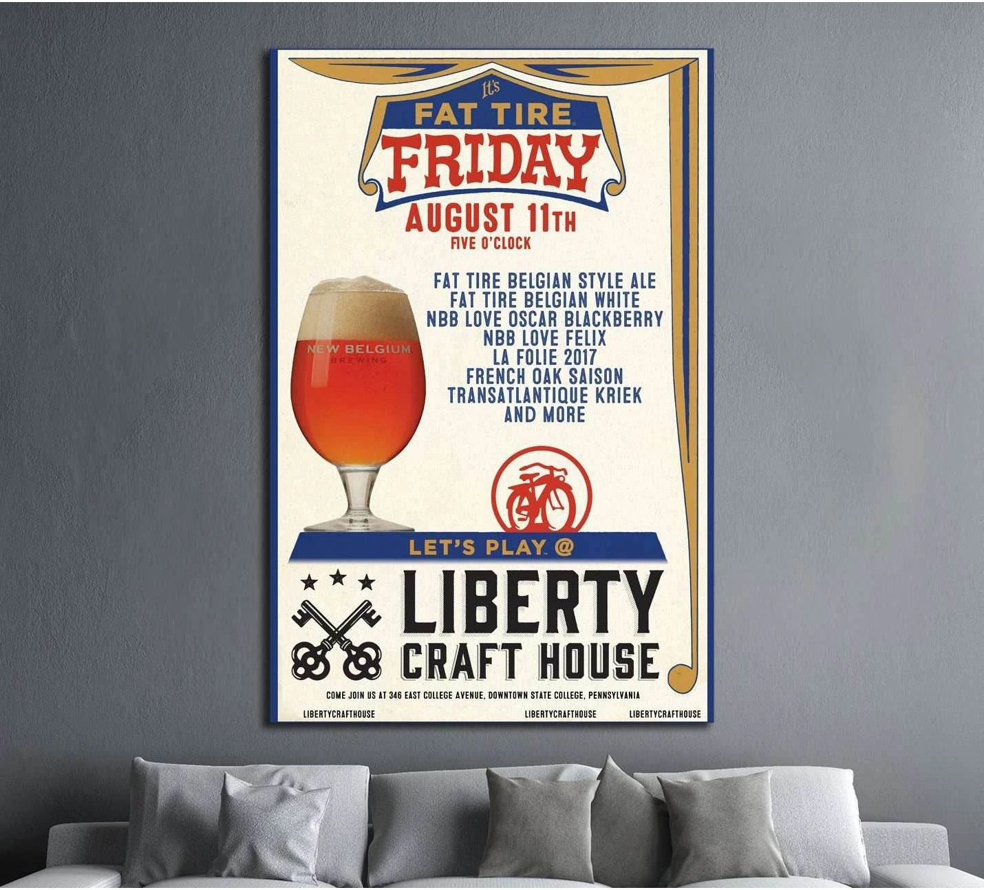 Vintage beer poster canvas print with amber ale glass and retro pub typography above sofa in modern living room