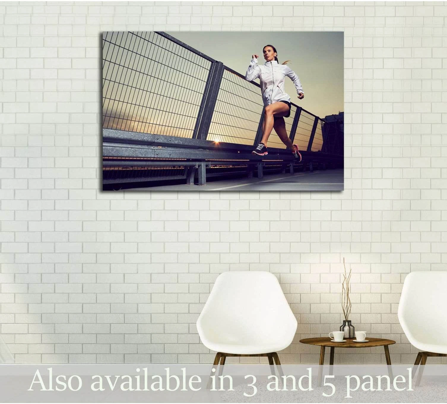 Woman running at sunset on an urban rooftop canvas print displayed above chairs in a modern room