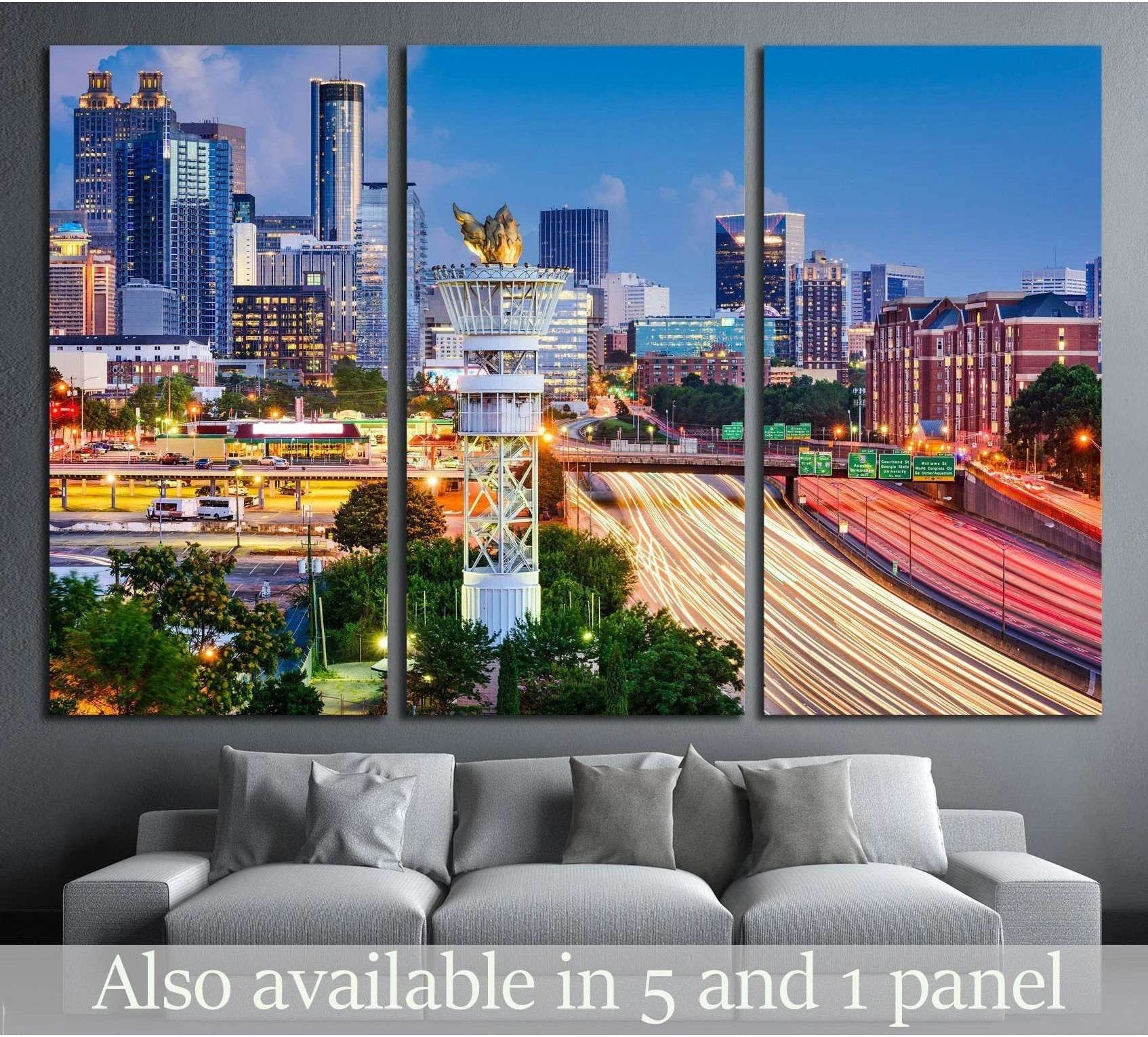 Atlanta skyline triptych canvas print with downtown towers and highway light trails above a gray sofa
