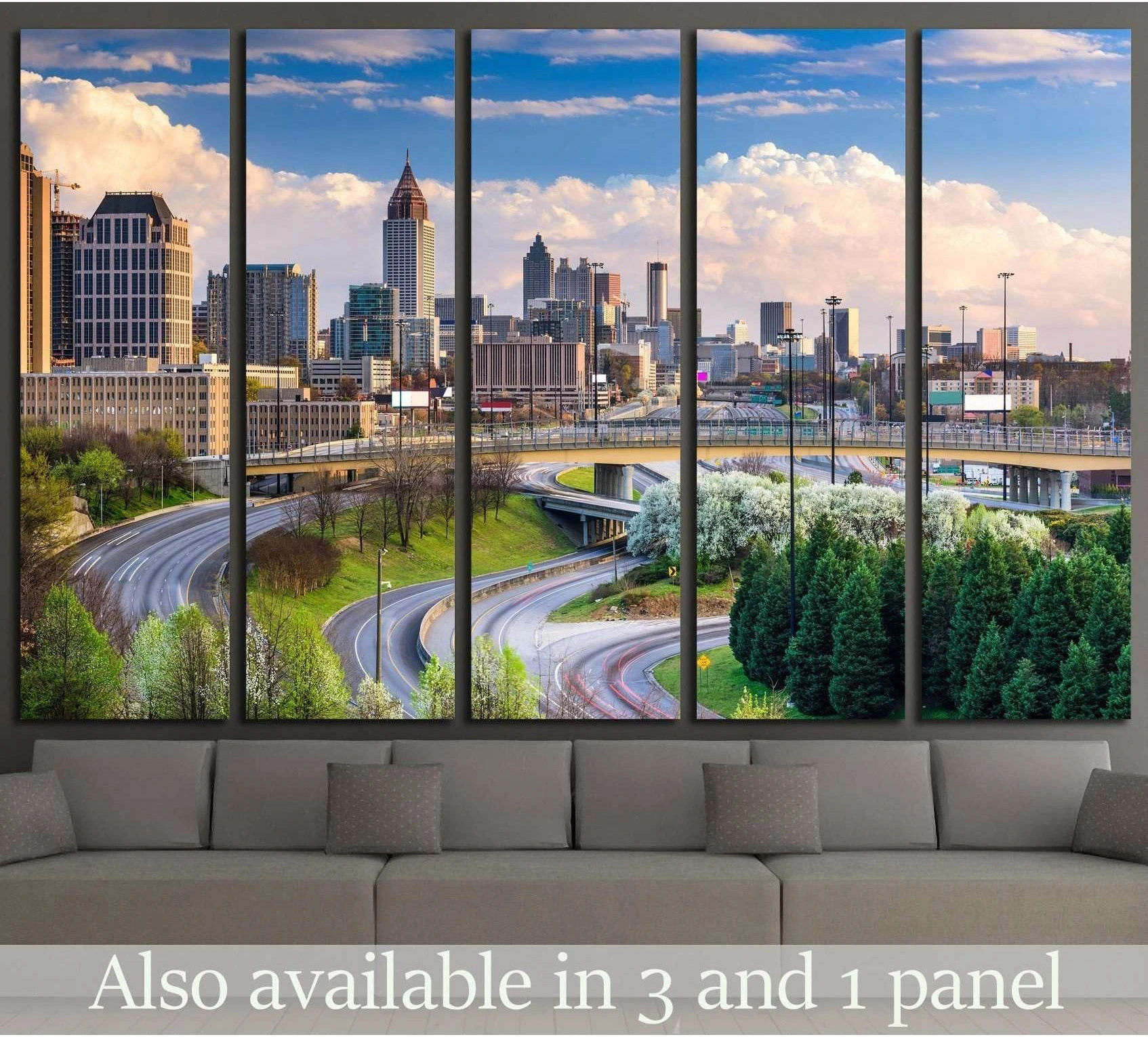 Atlanta skyline canvas print with downtown towers and curving highways above a sofa in a modern living room