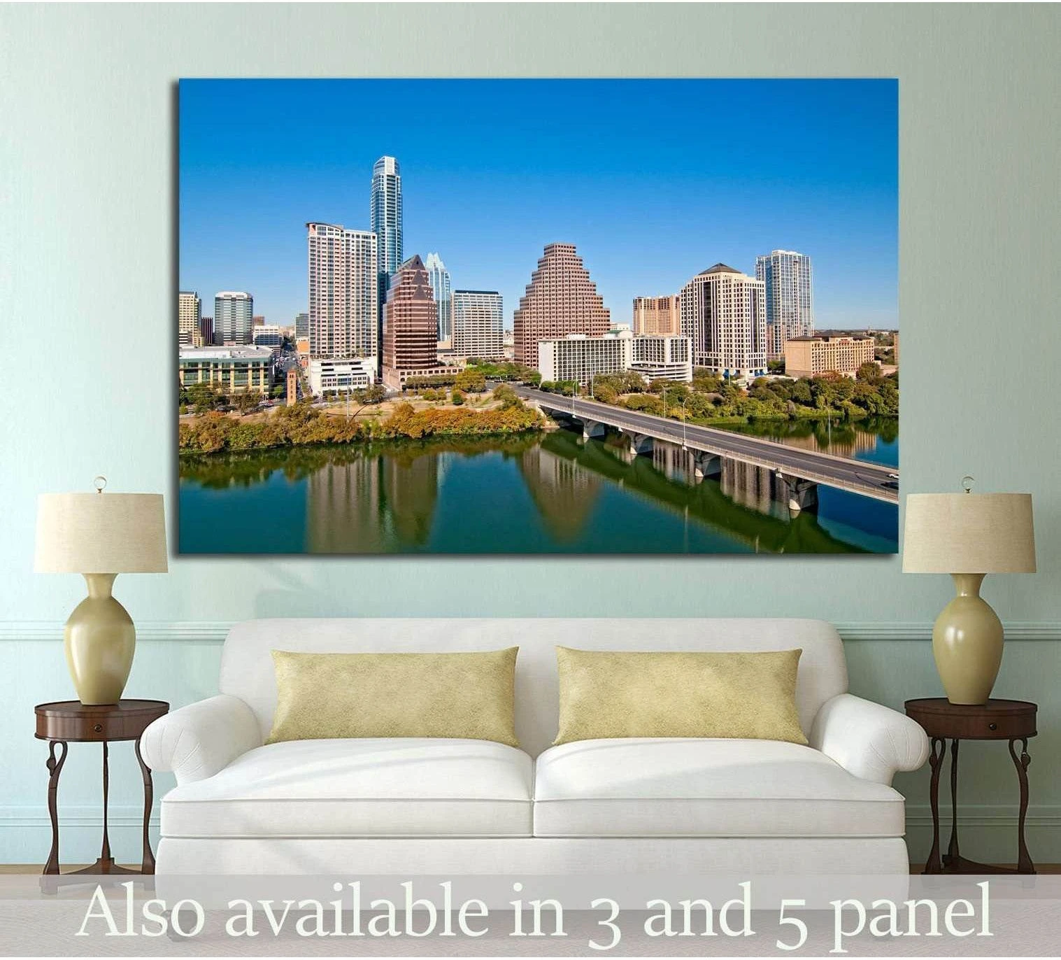Austin skyline canvas print with downtown towers, bridge, and river above a sofa