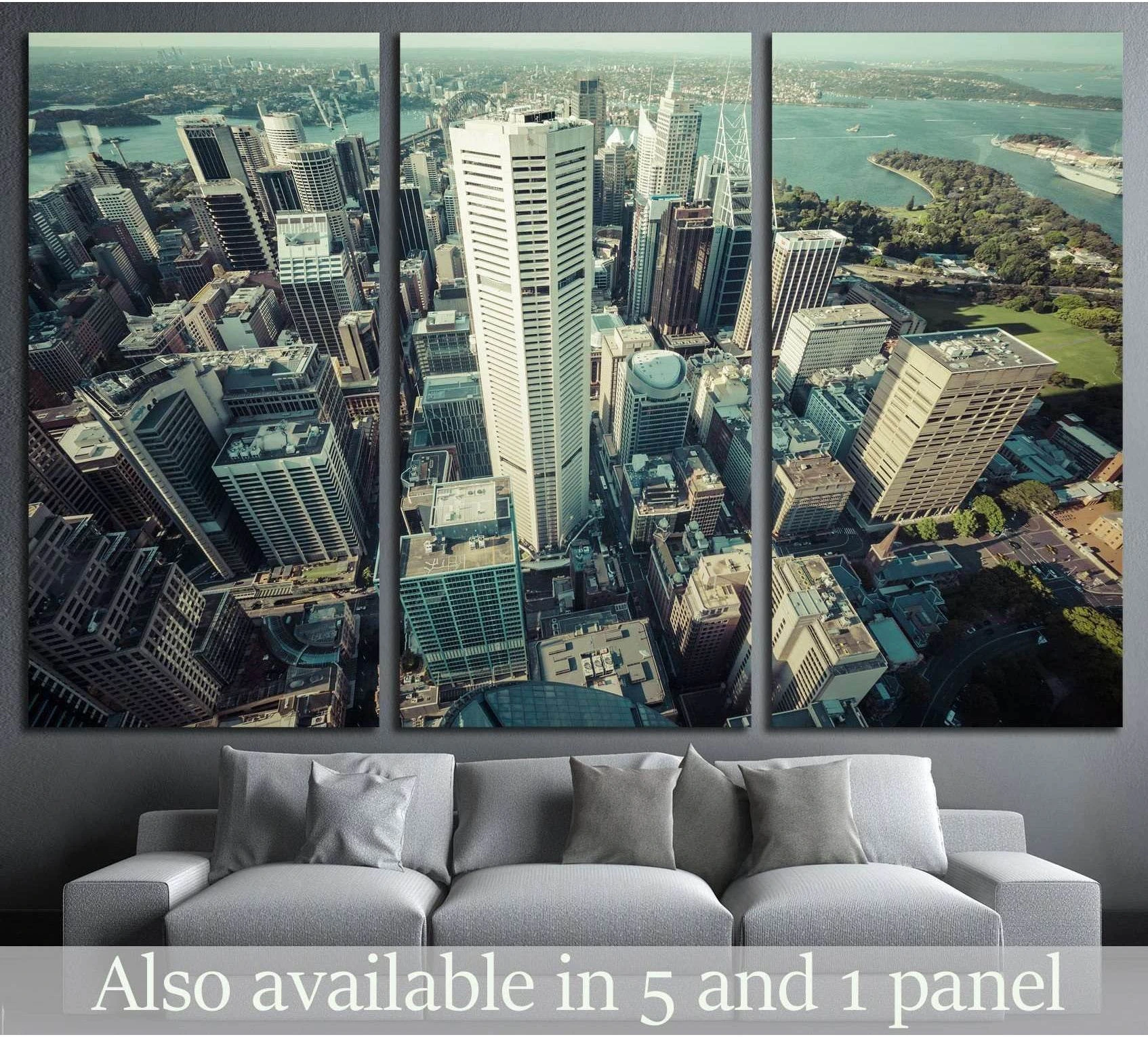 Sydney CBD aerial triptych canvas print hung above a sofa in a modern living room