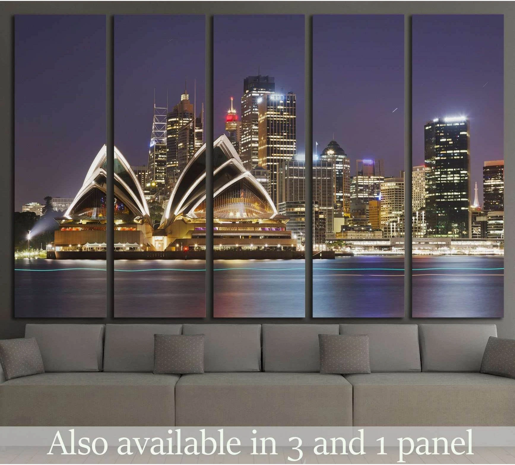 Sydney Opera House and skyline canvas print at night above a sofa in a modern living room