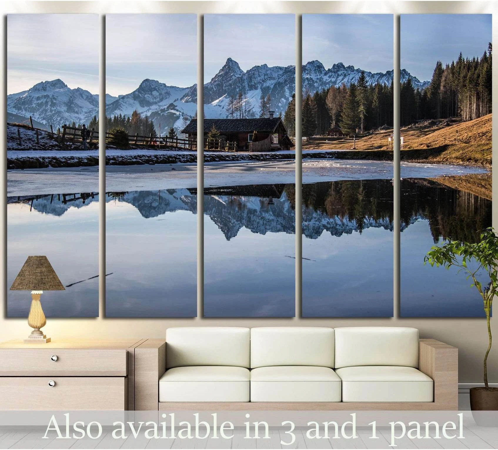 Austria alpine lake reflection canvas print with snowy mountains, chalet, and pine forest above a sofa