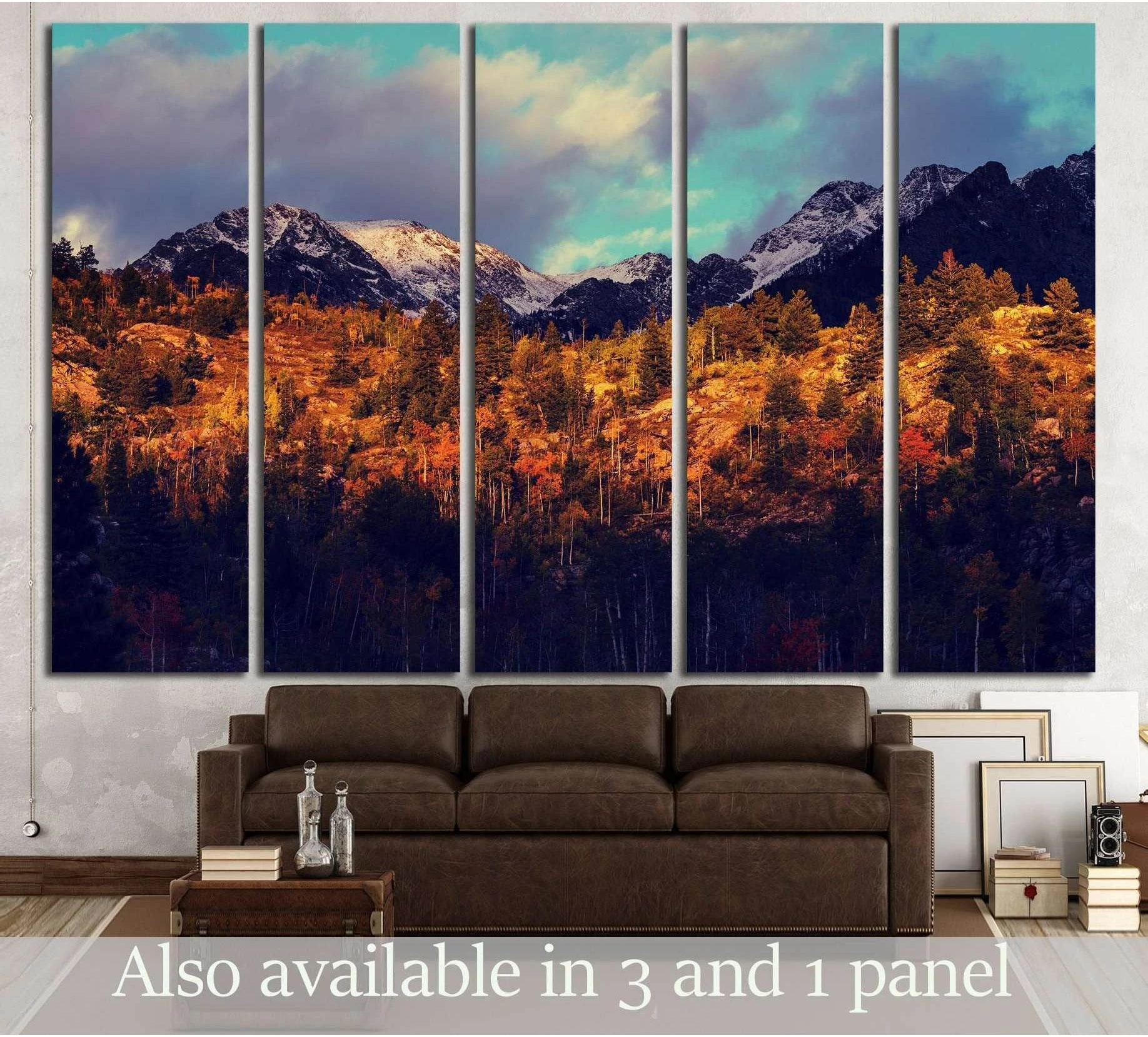 Colorado mountain canvas print with golden aspen forest and snowy peaks above a brown sofa