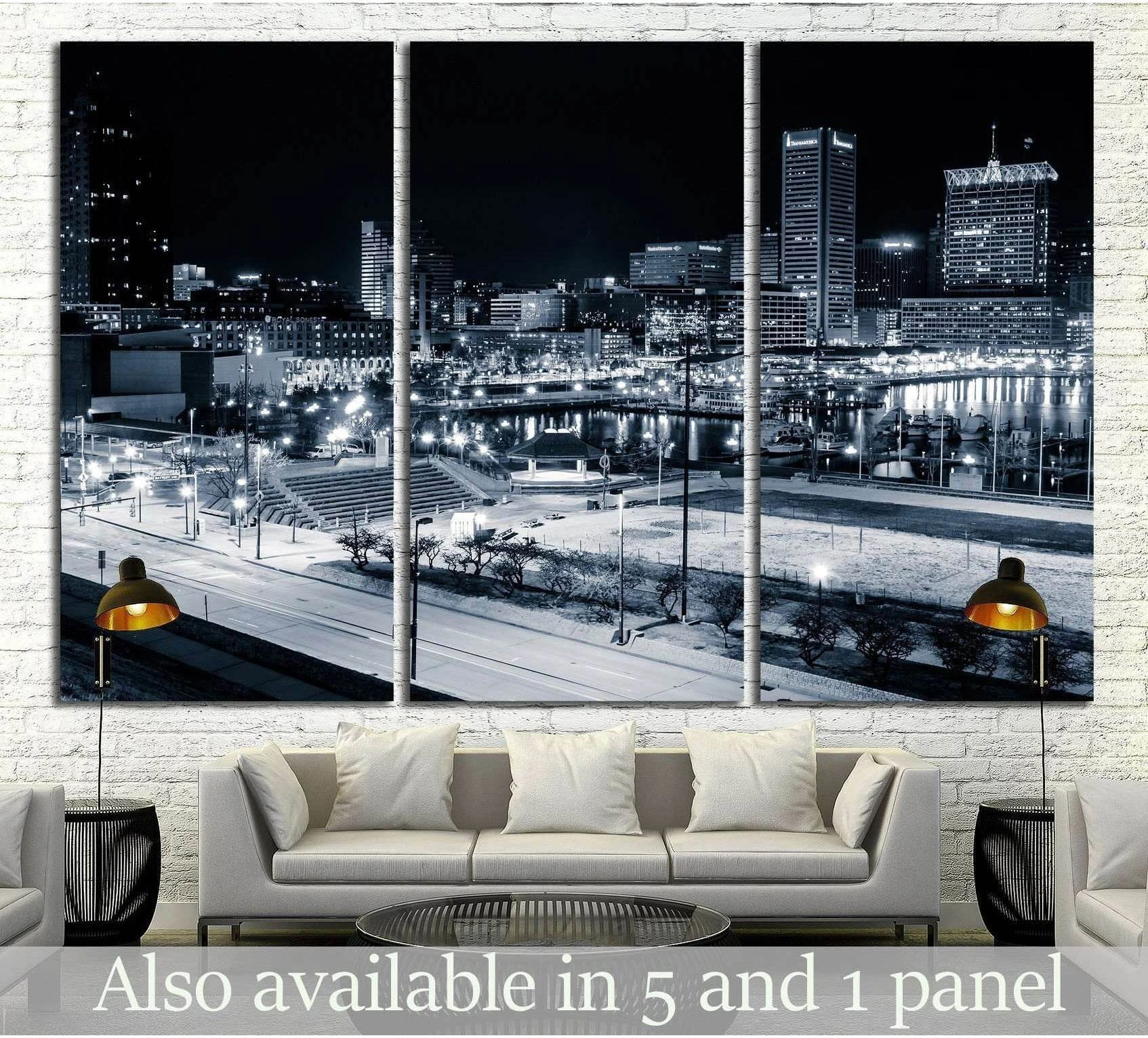 Black and white Baltimore Inner Harbor skyline triptych canvas print hung above a sofa in a modern living room