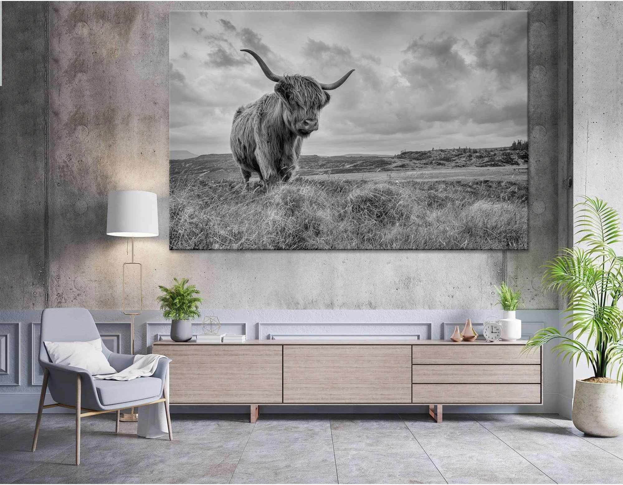 A black and white photograph of a Highland cow in a field of tall grass, with a dramatic sky and mountains in the background., product view 5