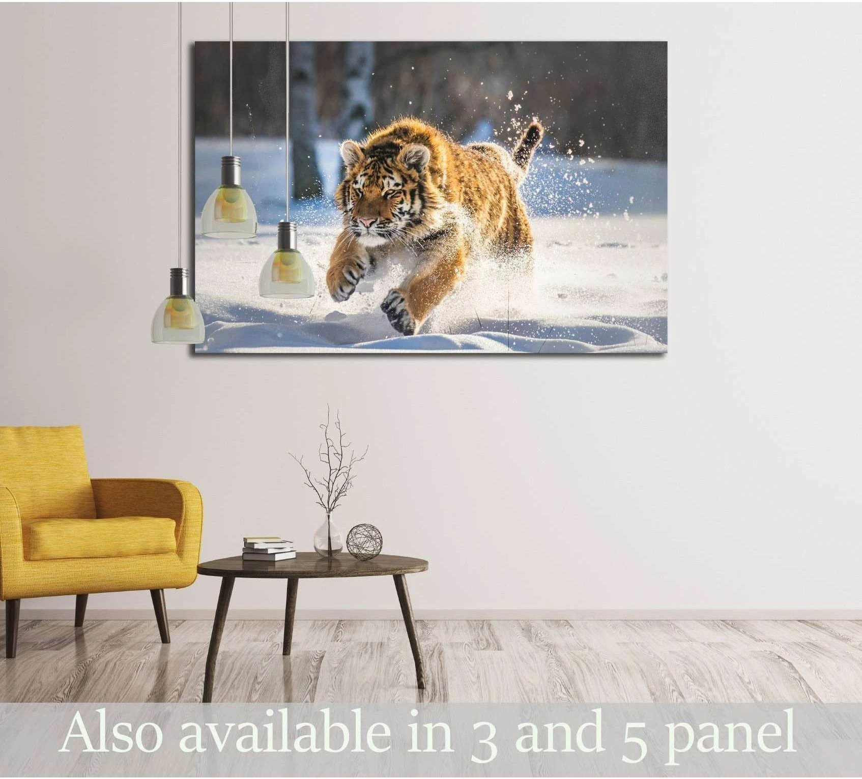 Tiger canvas print of a tiger running through snow, displayed above a sofa in a modern living room