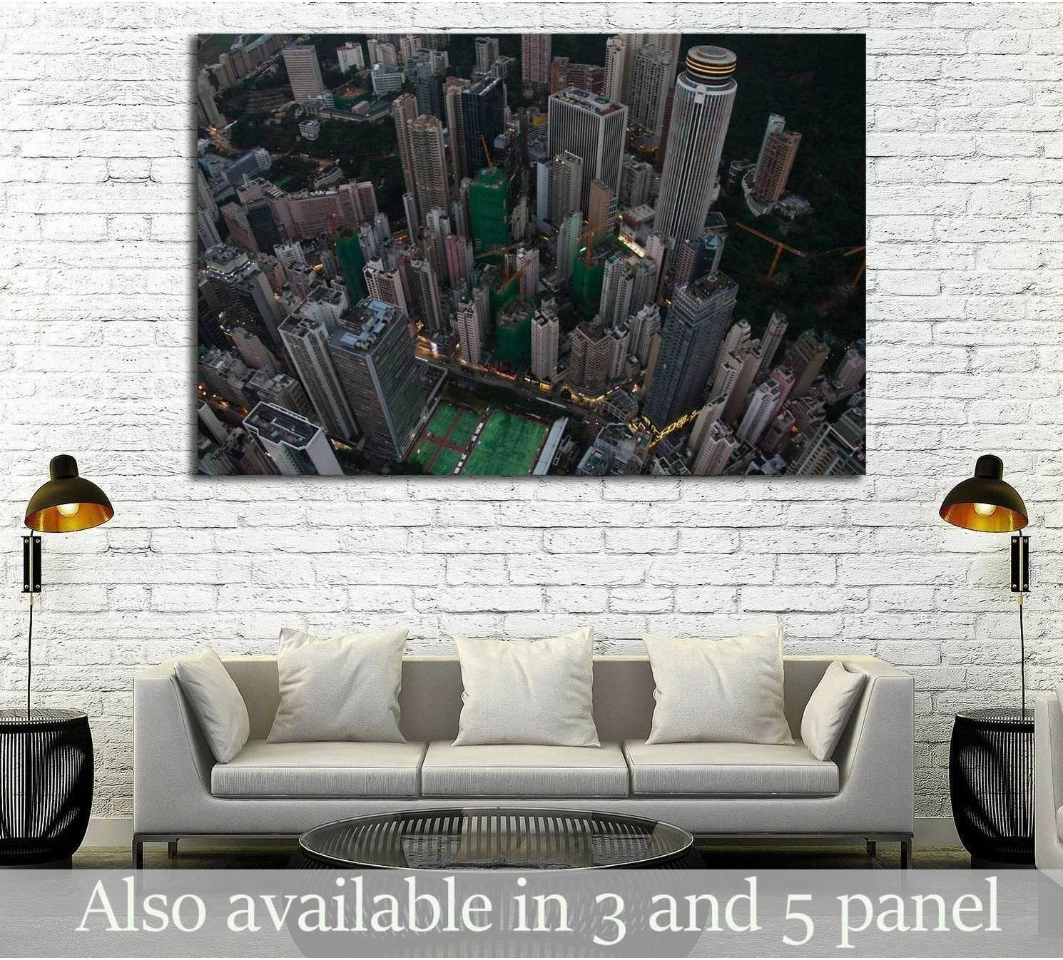 Hong Kong skyline aerial canvas print hung above a sofa in a modern living room