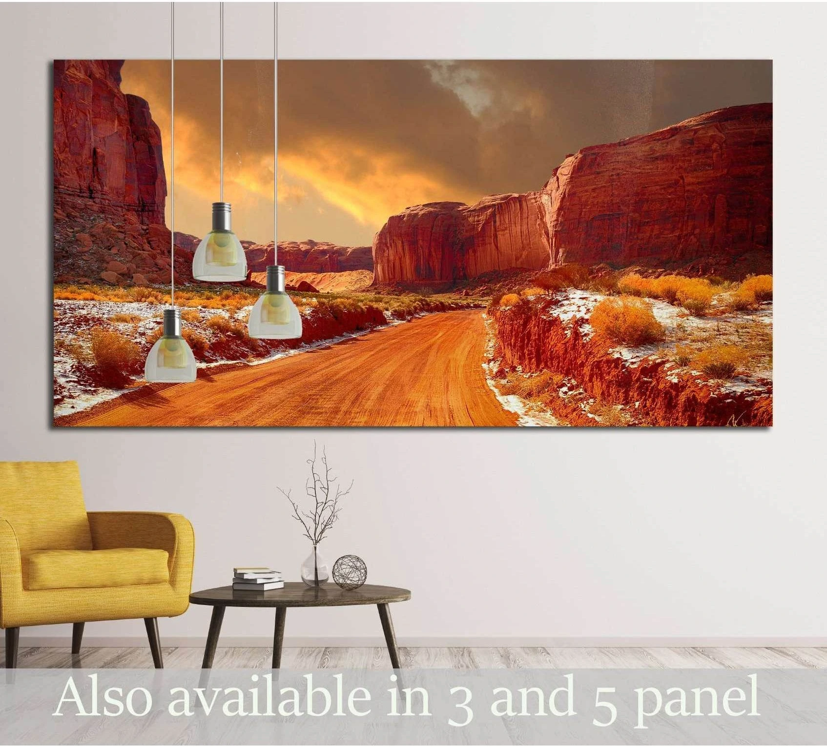 Monument Valley winter road canvas print with red rock cliffs above a sofa in a modern room