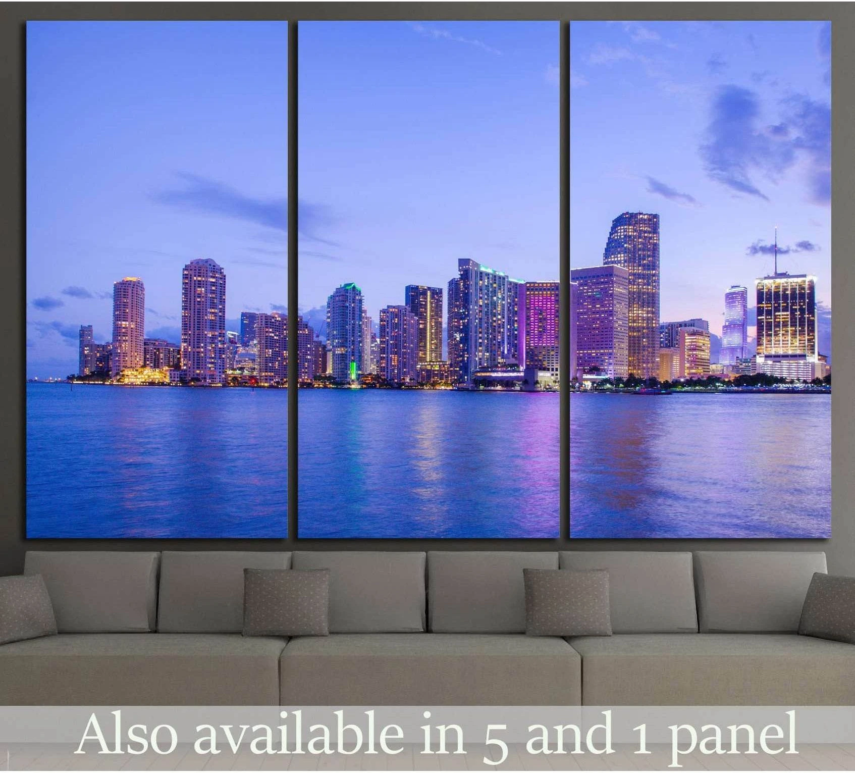 Miami skyline triptych canvas print above sofa with purple twilight sky and waterfront reflections