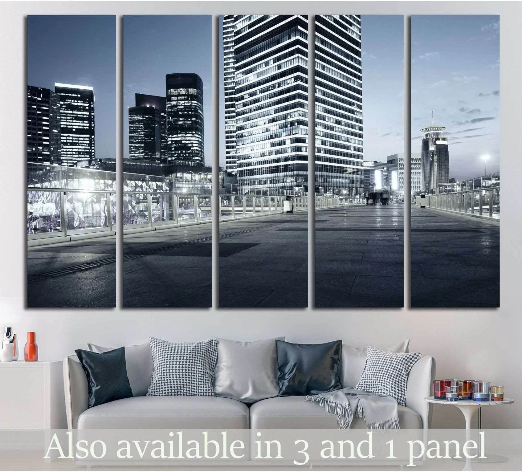 Shanghai skyline canvas print with blue-gray skyscrapers at night above a sofa in a modern living room