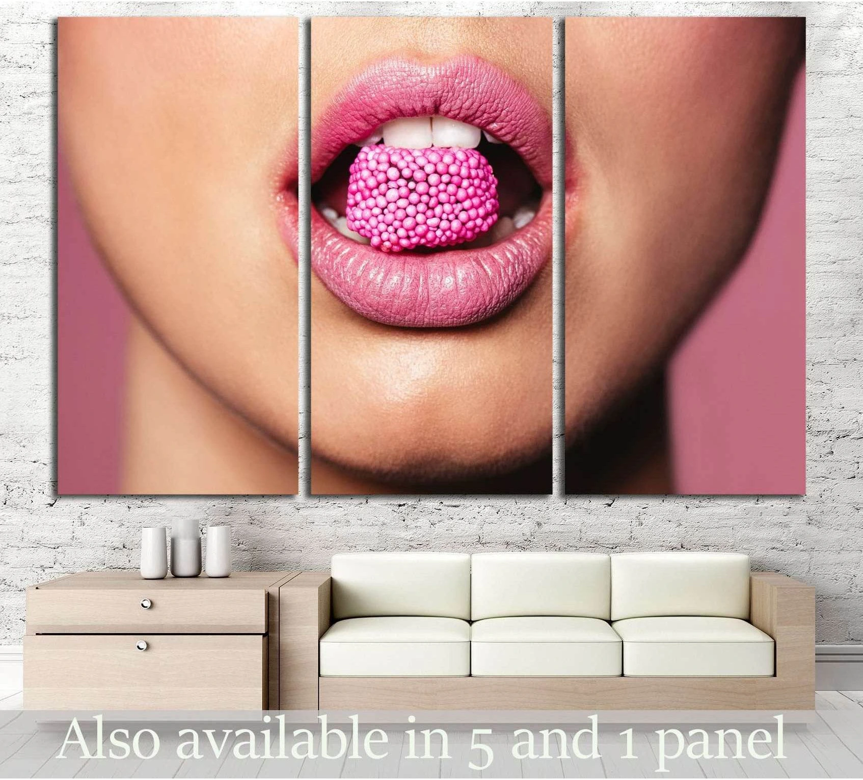 Pink lips candy canvas print in blush tones, shown as triptych wall art above a sofa