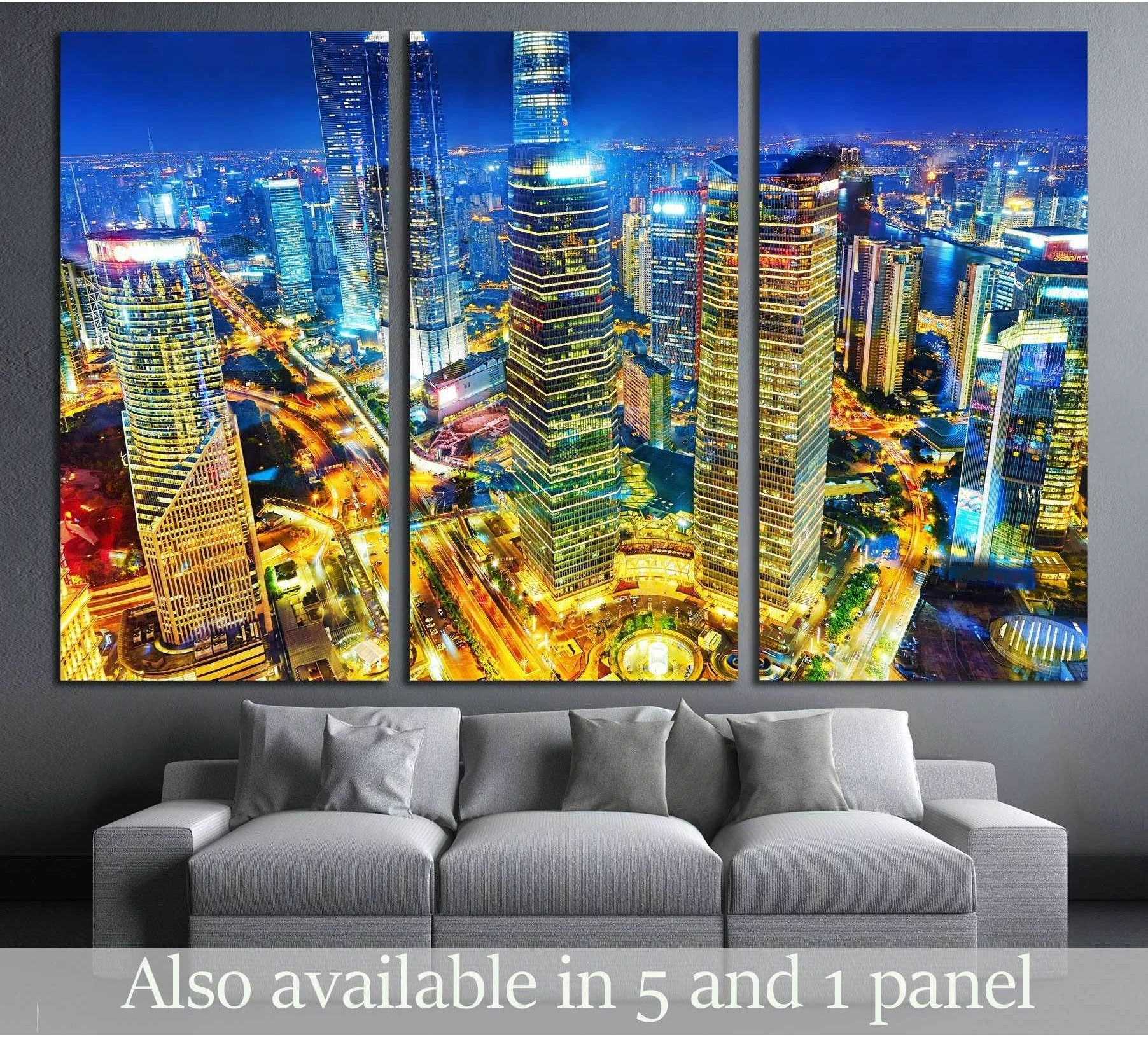 Shanghai Pudong skyline triptych canvas print with glowing blue towers and golden night traffic above a gray sofa