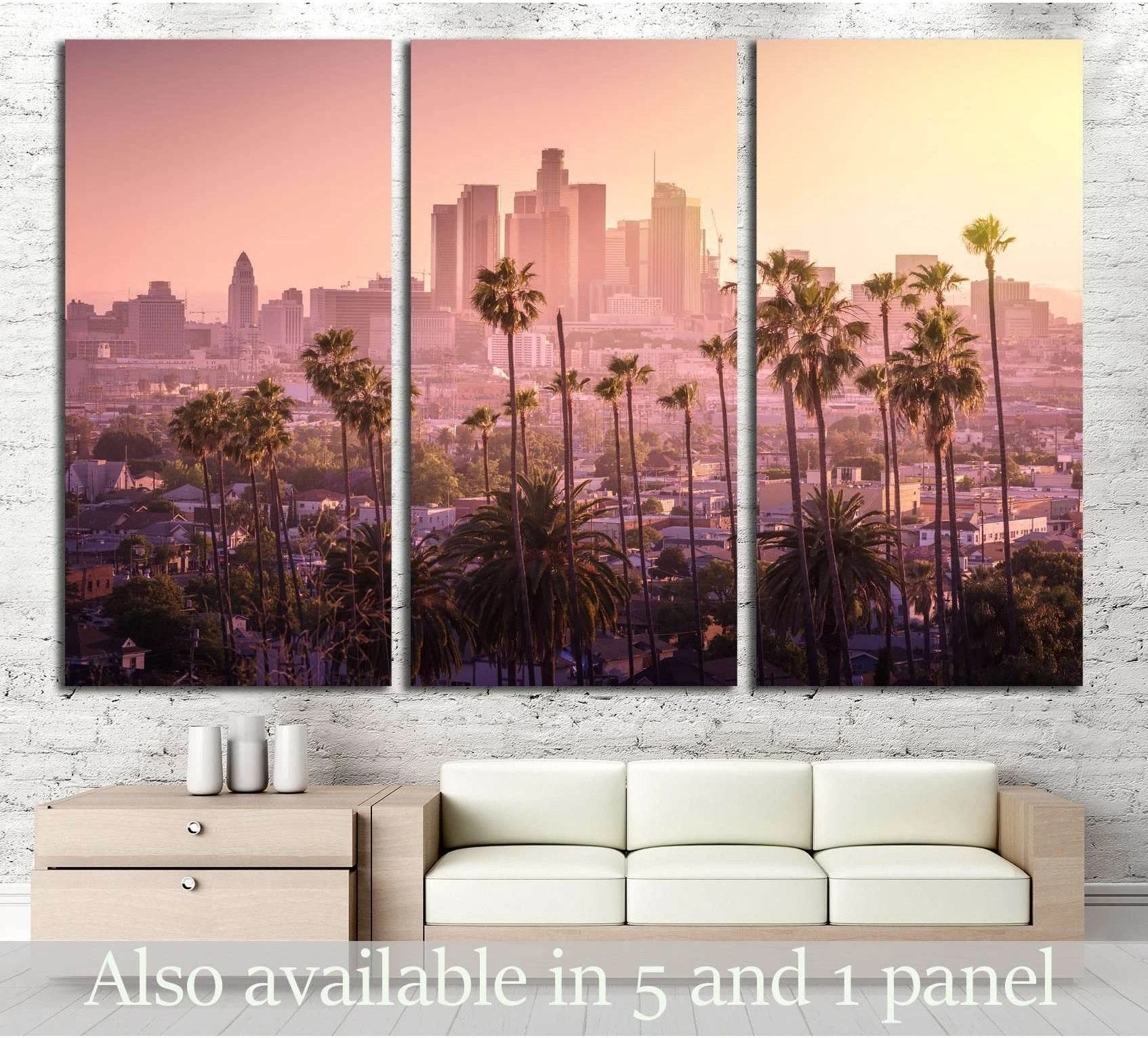 Los Angeles skyline triptych canvas print with palm trees at pink sunset above a sofa