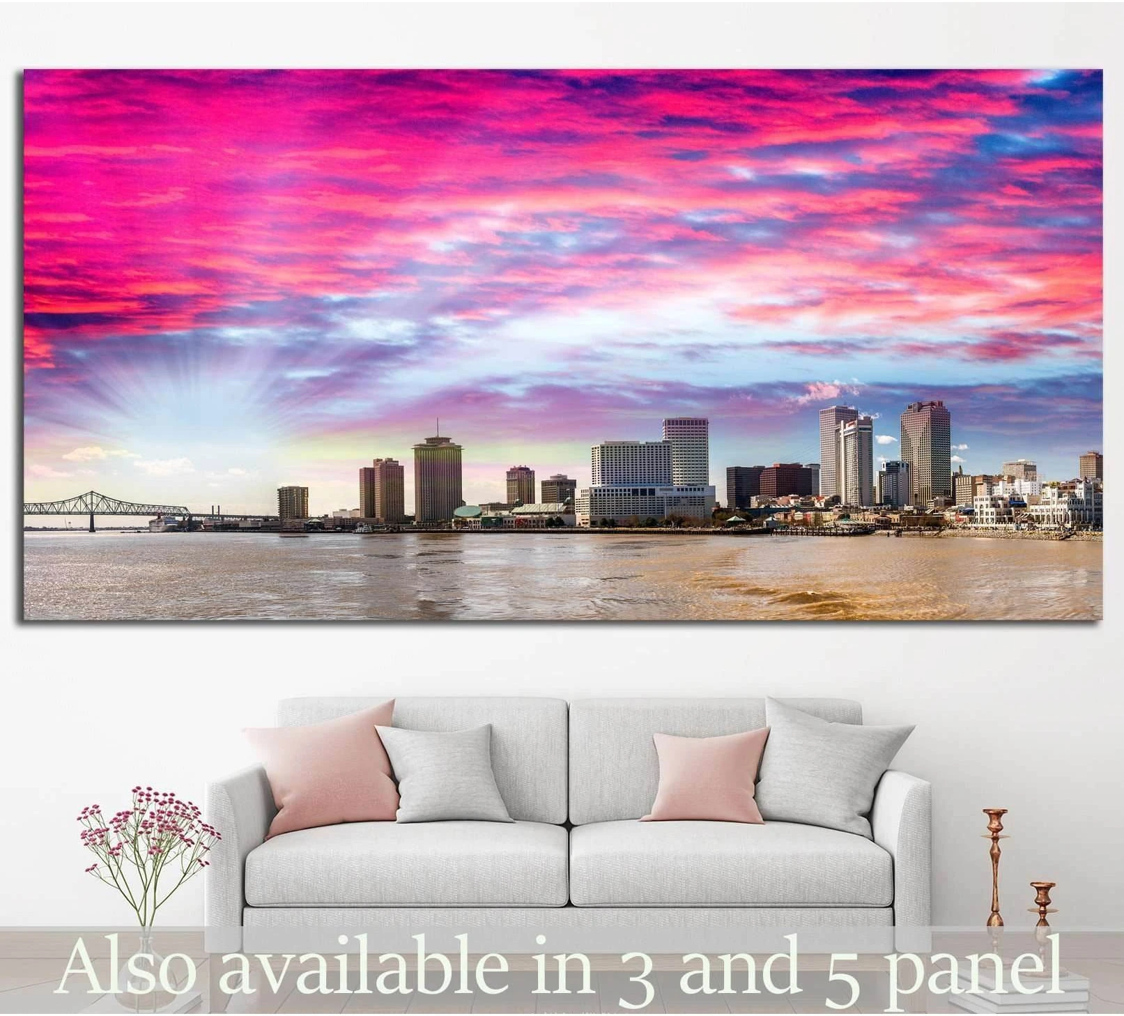 New Orleans skyline canvas print with pink sunset sky above the river, displayed over a sofa