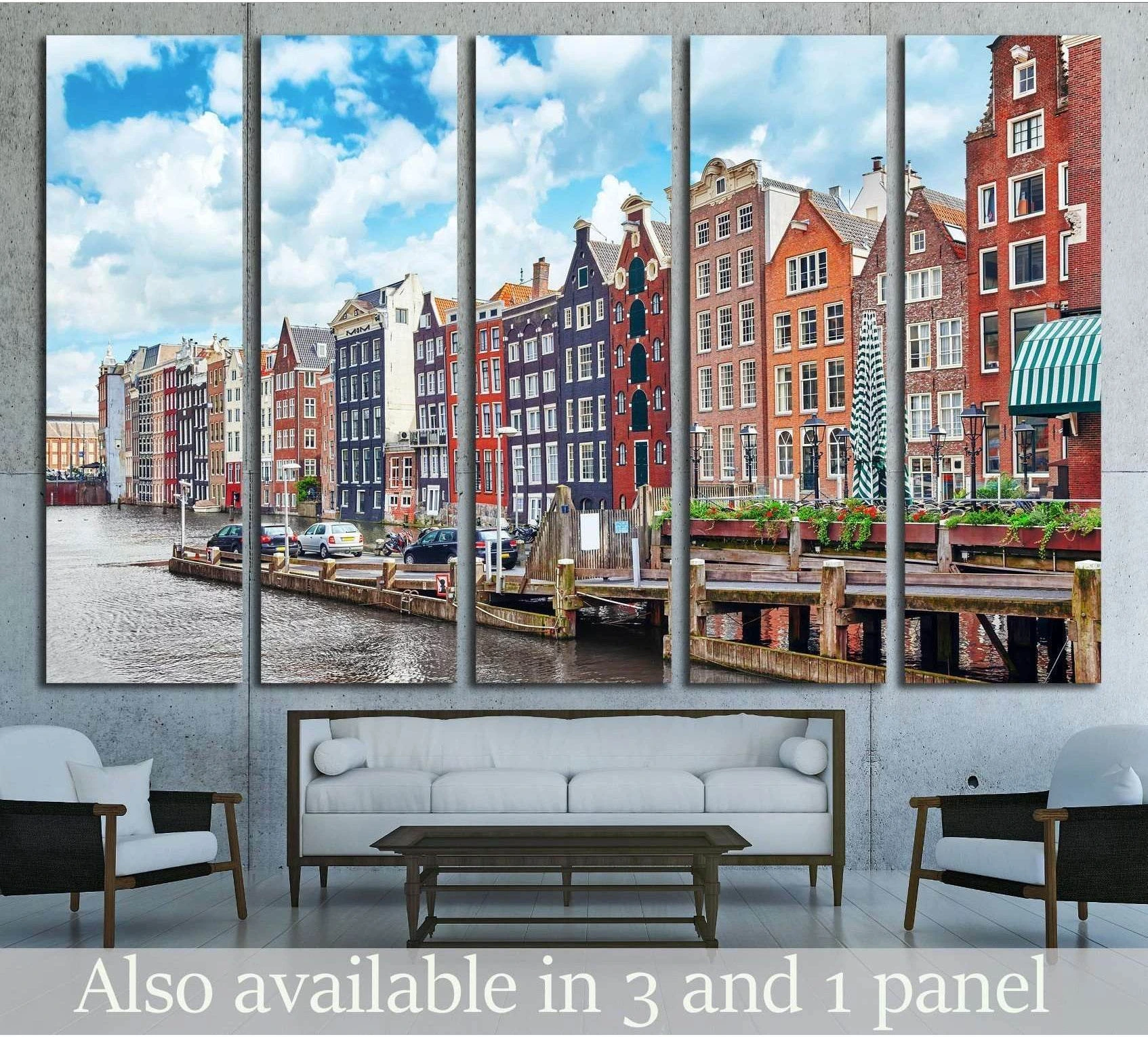 Amsterdam canal houses canvas print displayed as a five-panel artwork above a sofa in a modern living room