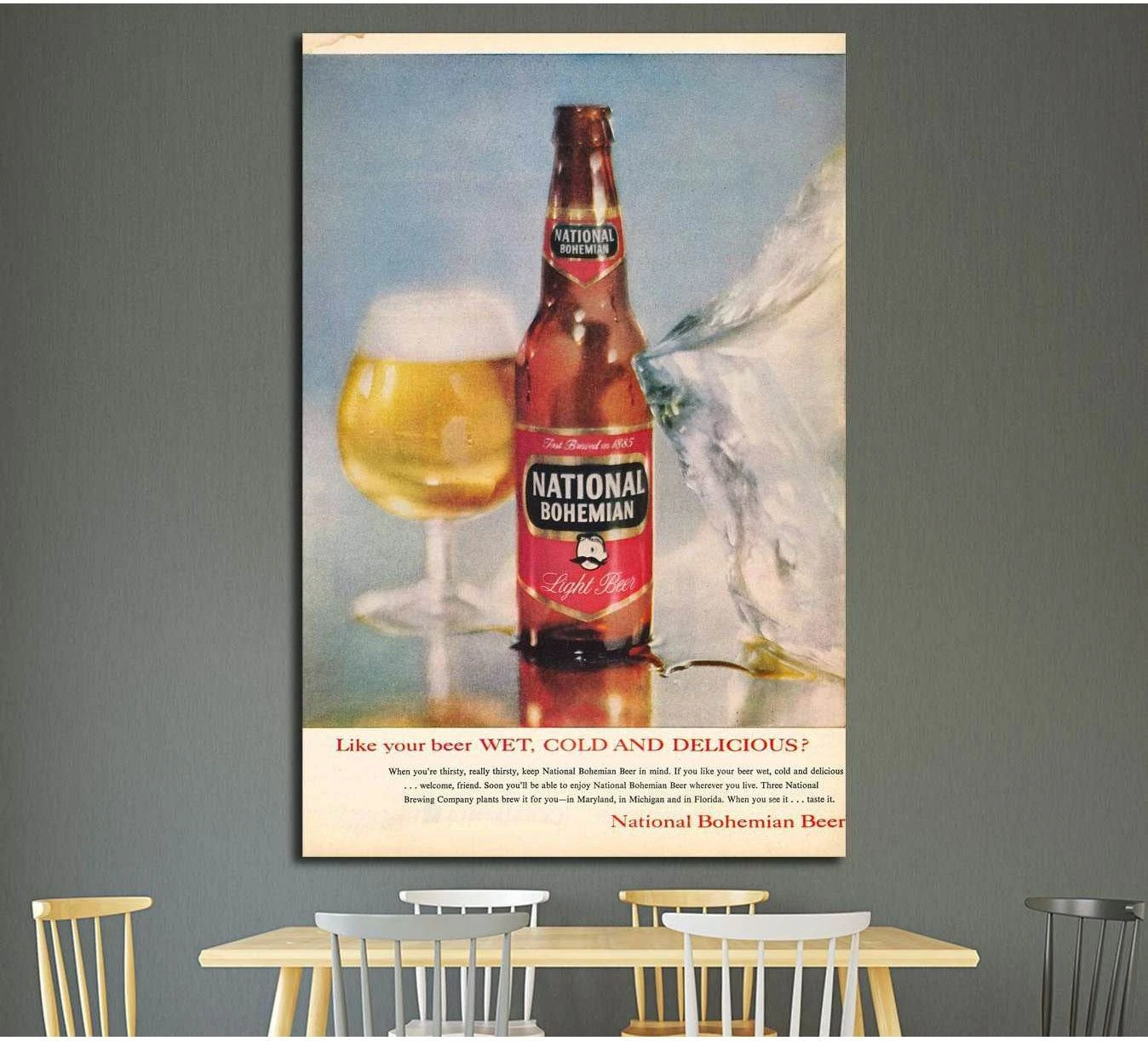 National Bohemian beer bottle and foamy glass vintage poster canvas print displayed above a dining table