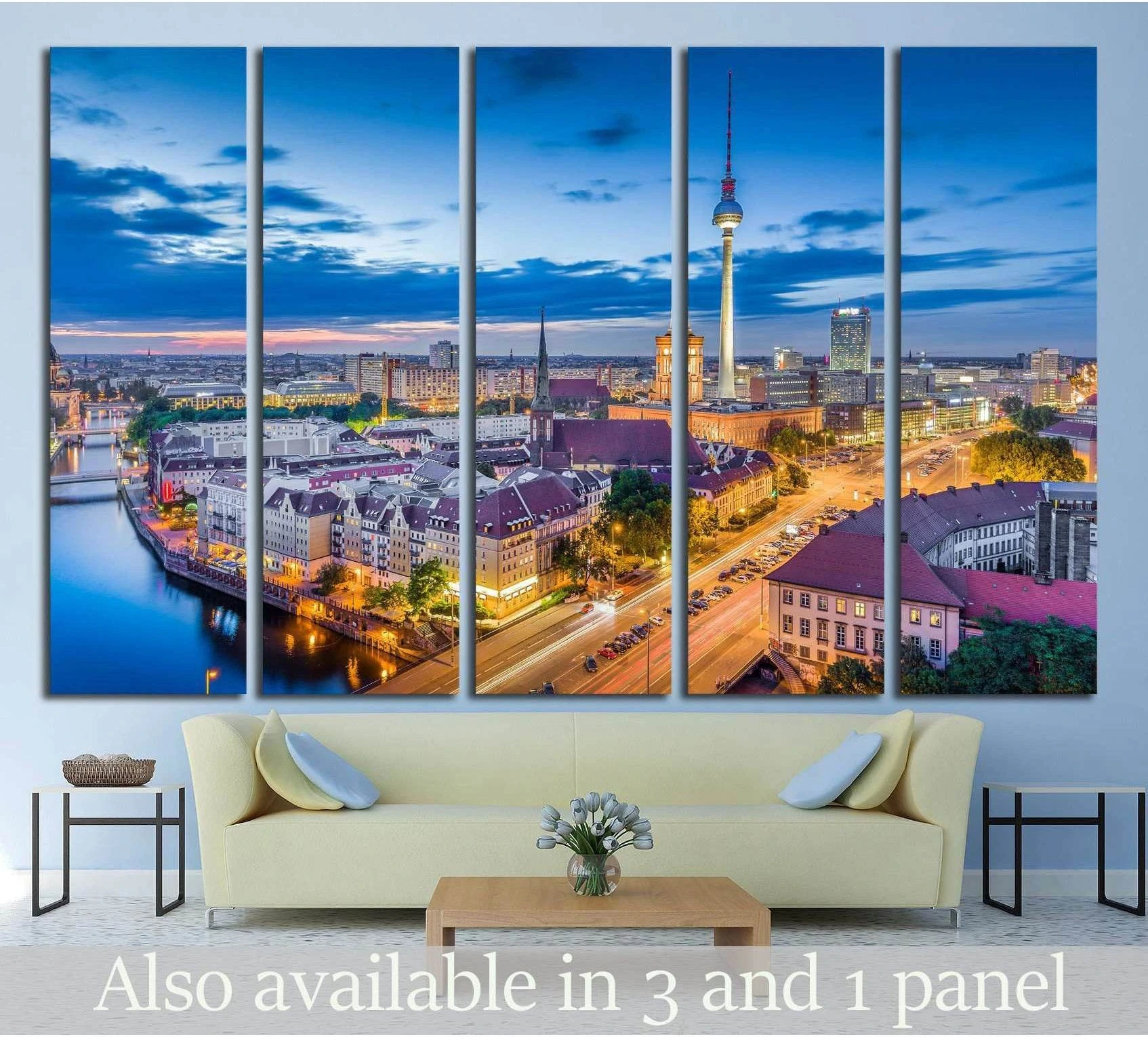 Berlin skyline canvas print with TV Tower at blue hour, displayed above a sofa in a modern living room