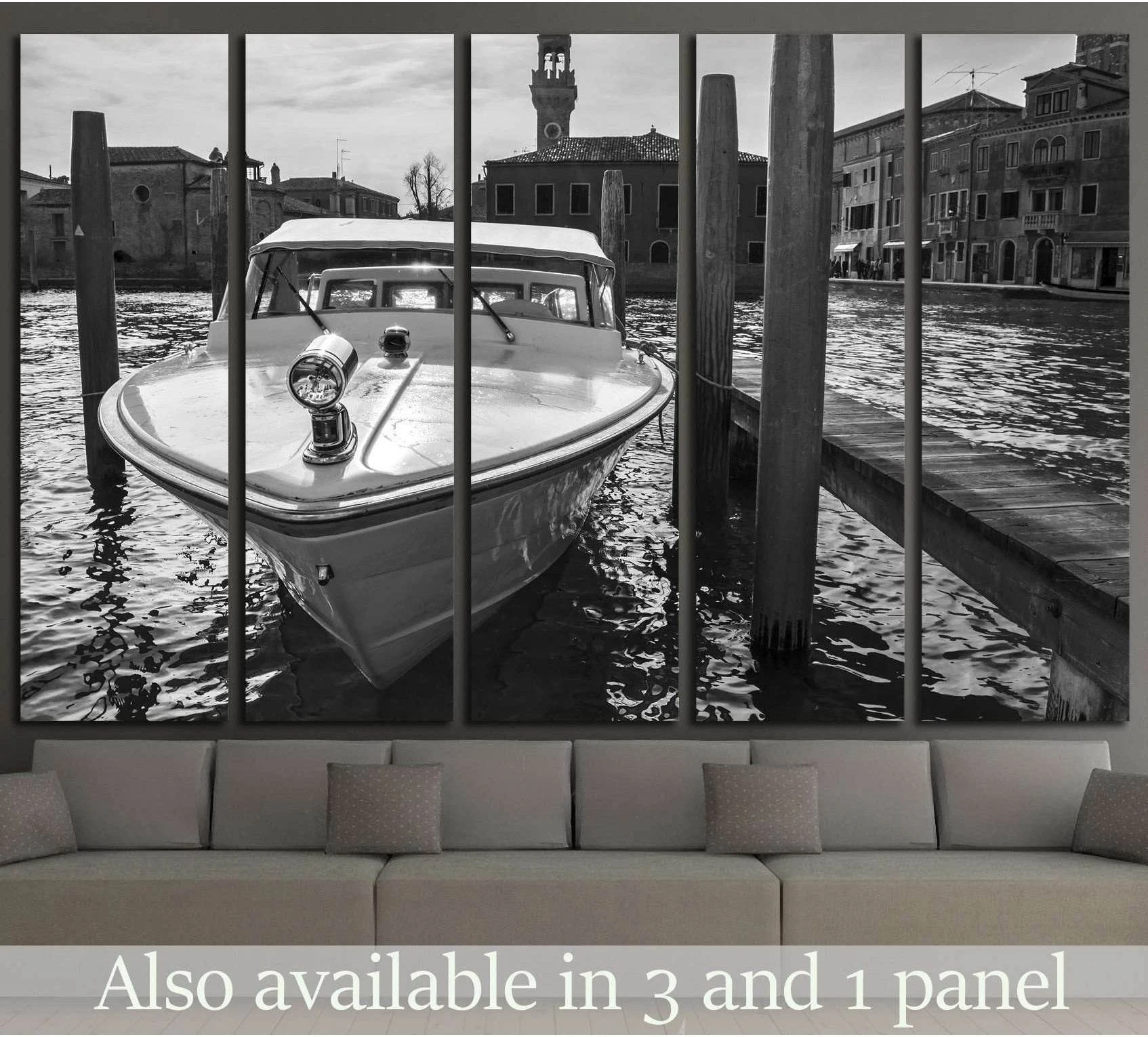 berthed boat on canal in Venice in a sunny day showing blue ocean wall art with water and coastal depth.