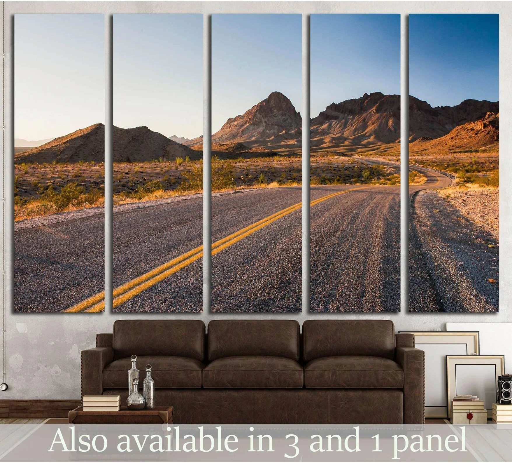 Route 66 desert road canvas print with winding highway and mountains above a sofa in a modern living room