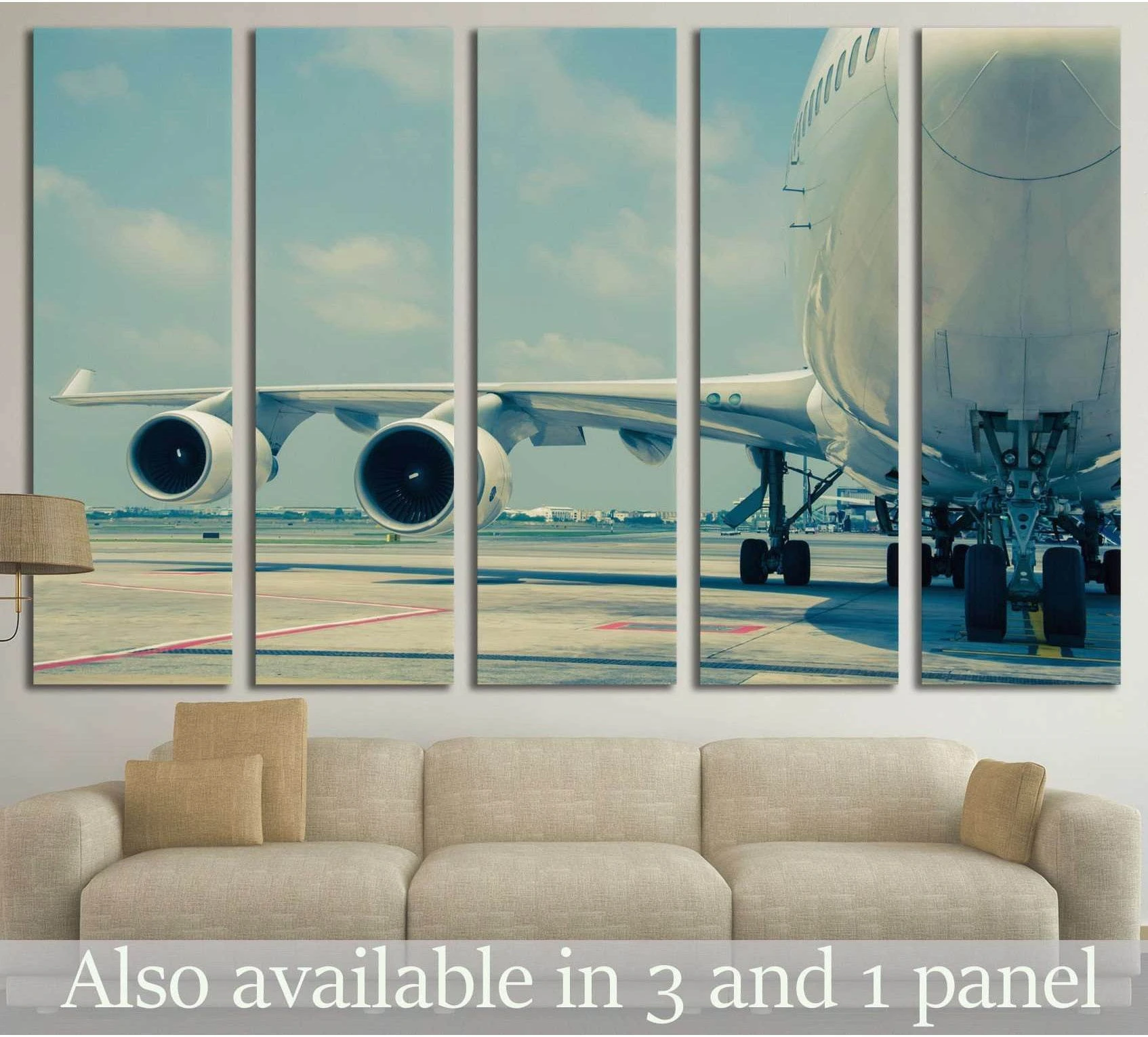 Commercial jet runway canvas print shown as five-panel wall art above a sofa in a modern living room