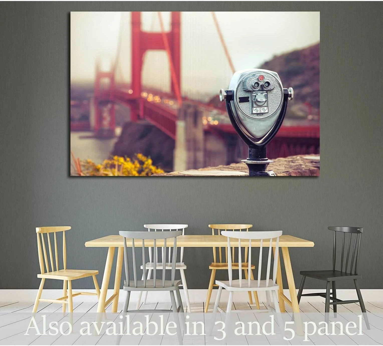 Coin-operated binocular and Golden Gate Bridge canvas print above dining table in a modern room