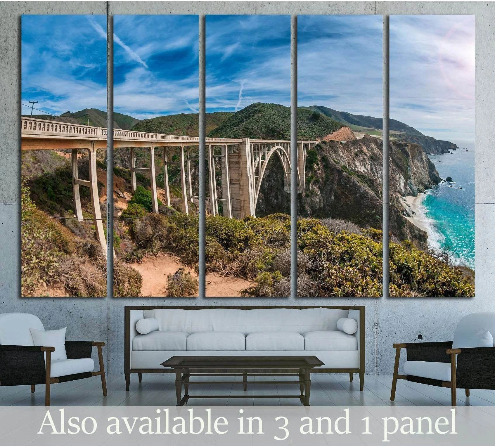 Bixby Bridge canvas print above a sofa with Big Sur cliffs, blue sky, and turquoise Pacific water