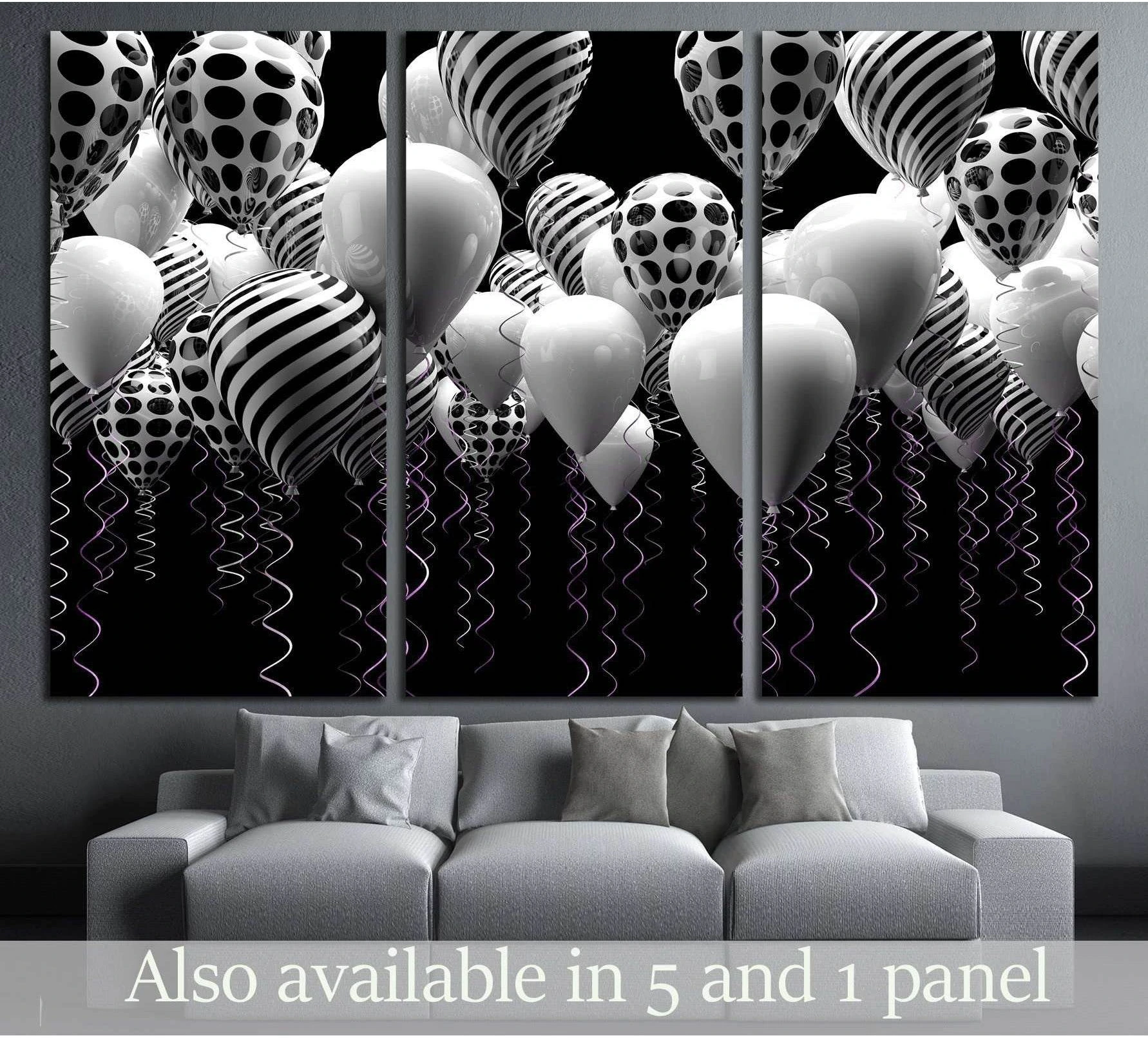 Black and white balloons canvas print with striped and polka dot balloons above a gray sofa