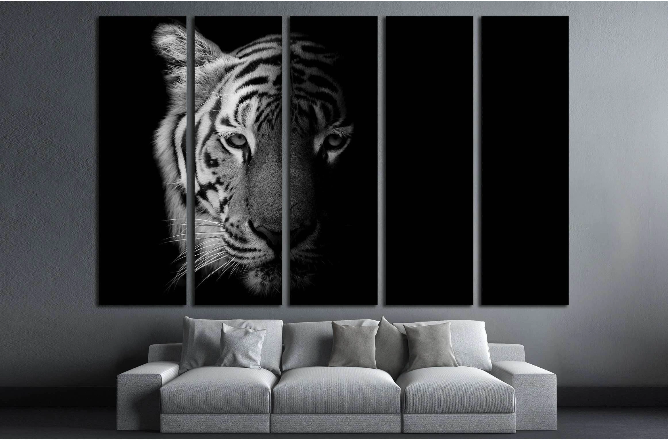 Black and white tiger canvas print in five panels above a sofa in a modern gray living room