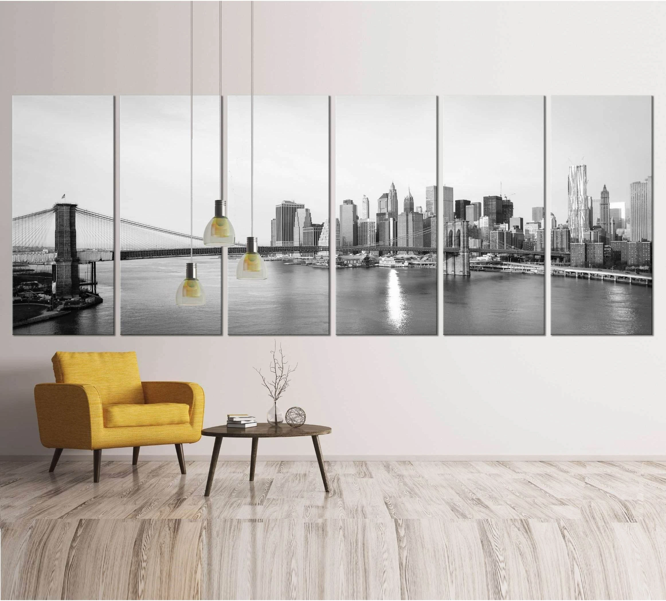 Black and white Brooklyn Bridge canvas print with Manhattan skyline hung in a modern living room