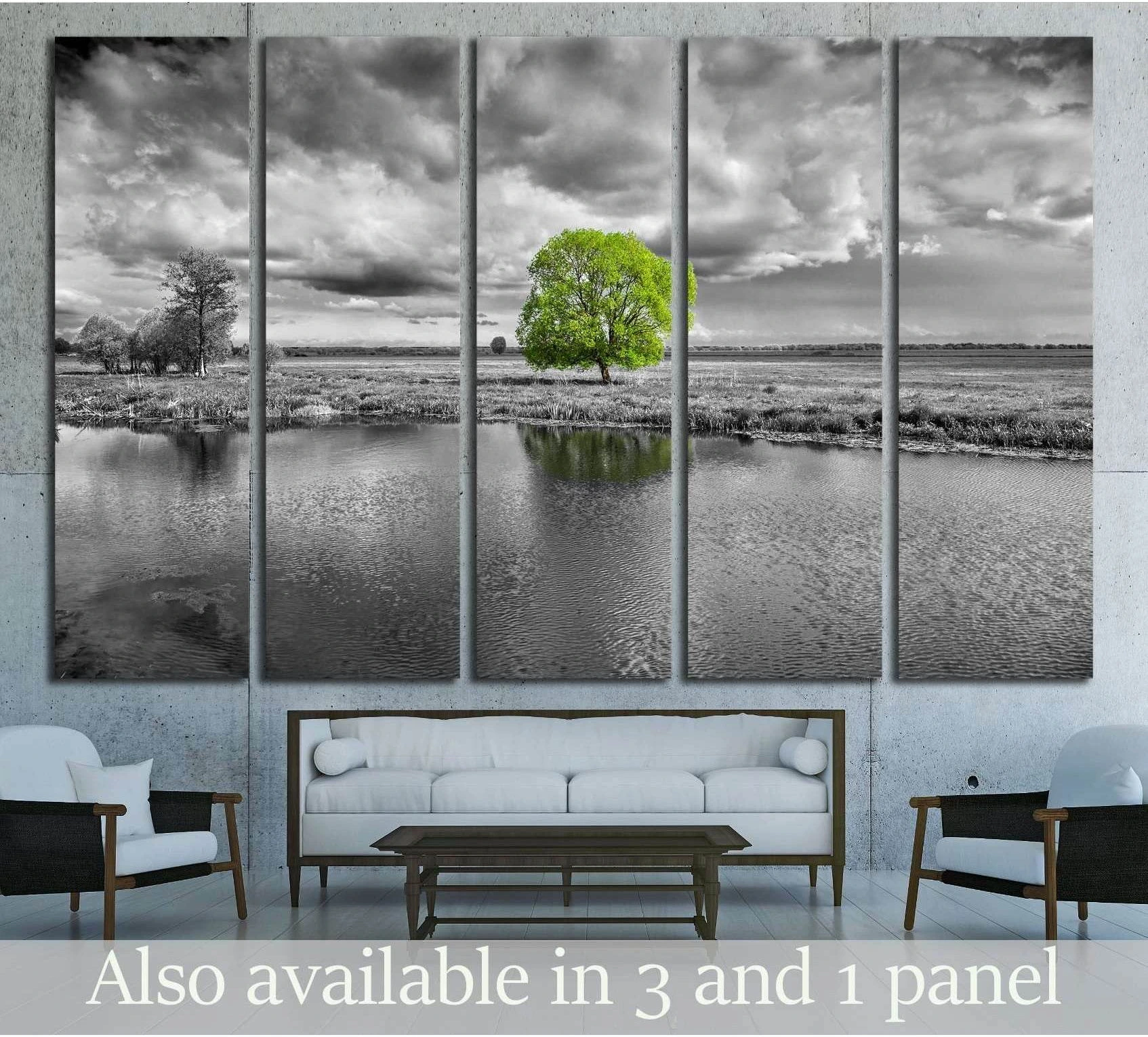 Five-panel black and white landscape canvas print with vivid green tree above a white sofa
