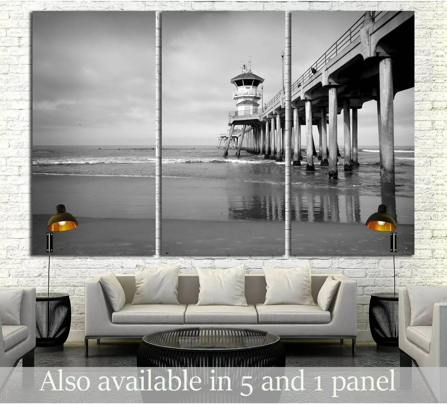 black and white photo of ocean pier with small waves selected as horizon-led seascapes with coastline and depth cues.