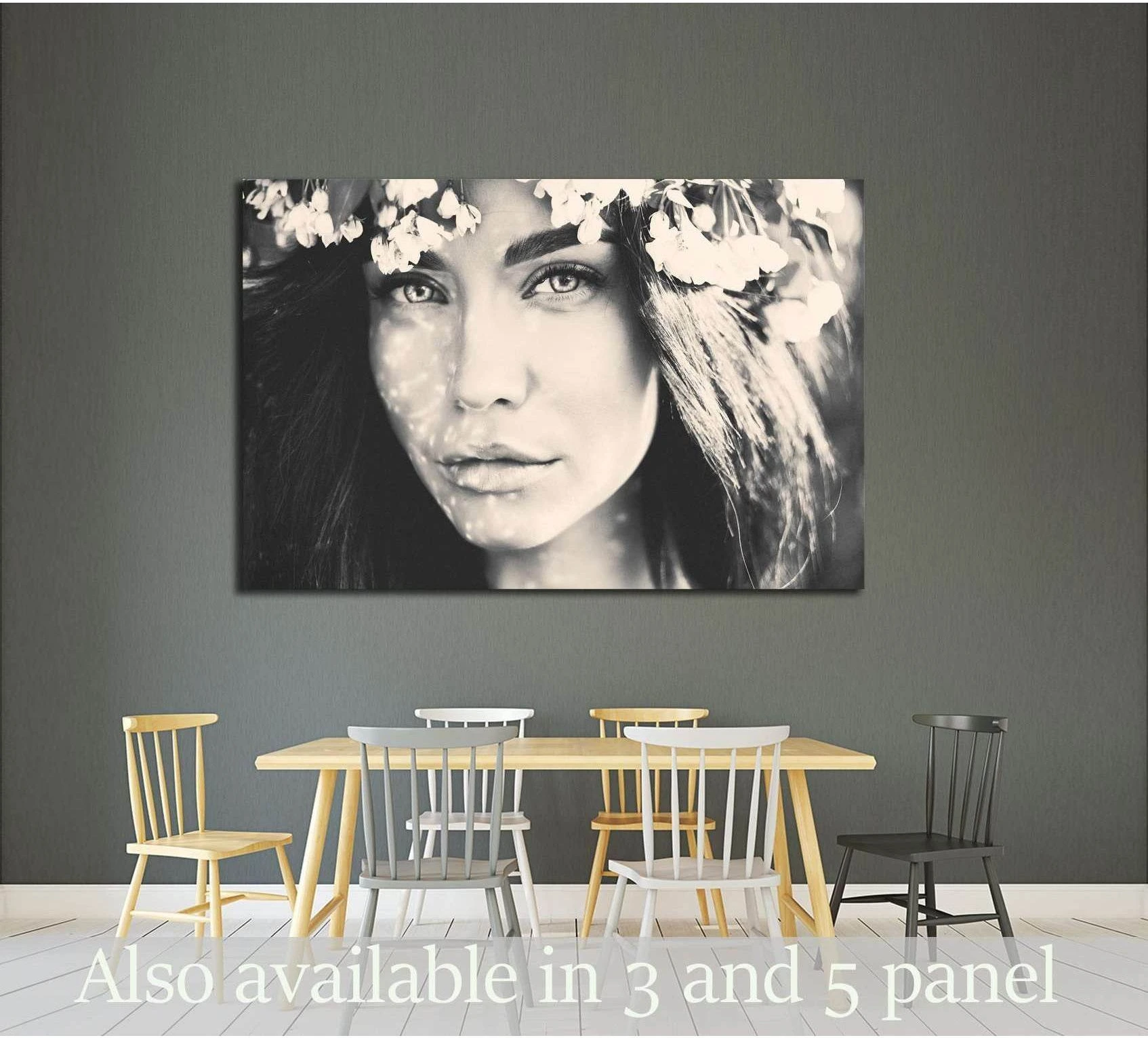Black and white woman portrait canvas print with floral crown above dining table in modern room