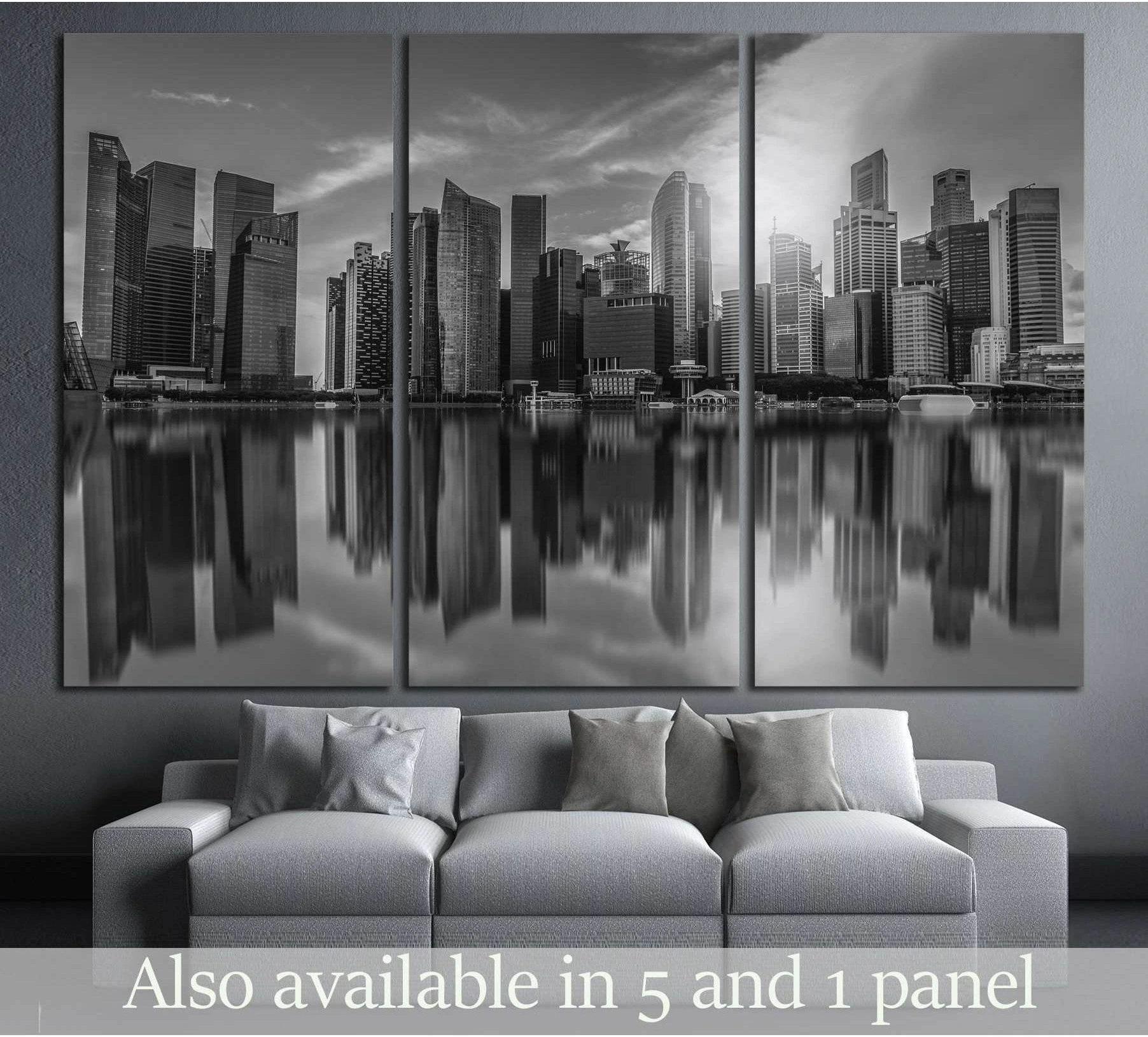 Black and white Singapore skyline canvas print with mirrored skyscraper reflections above a grey sofa