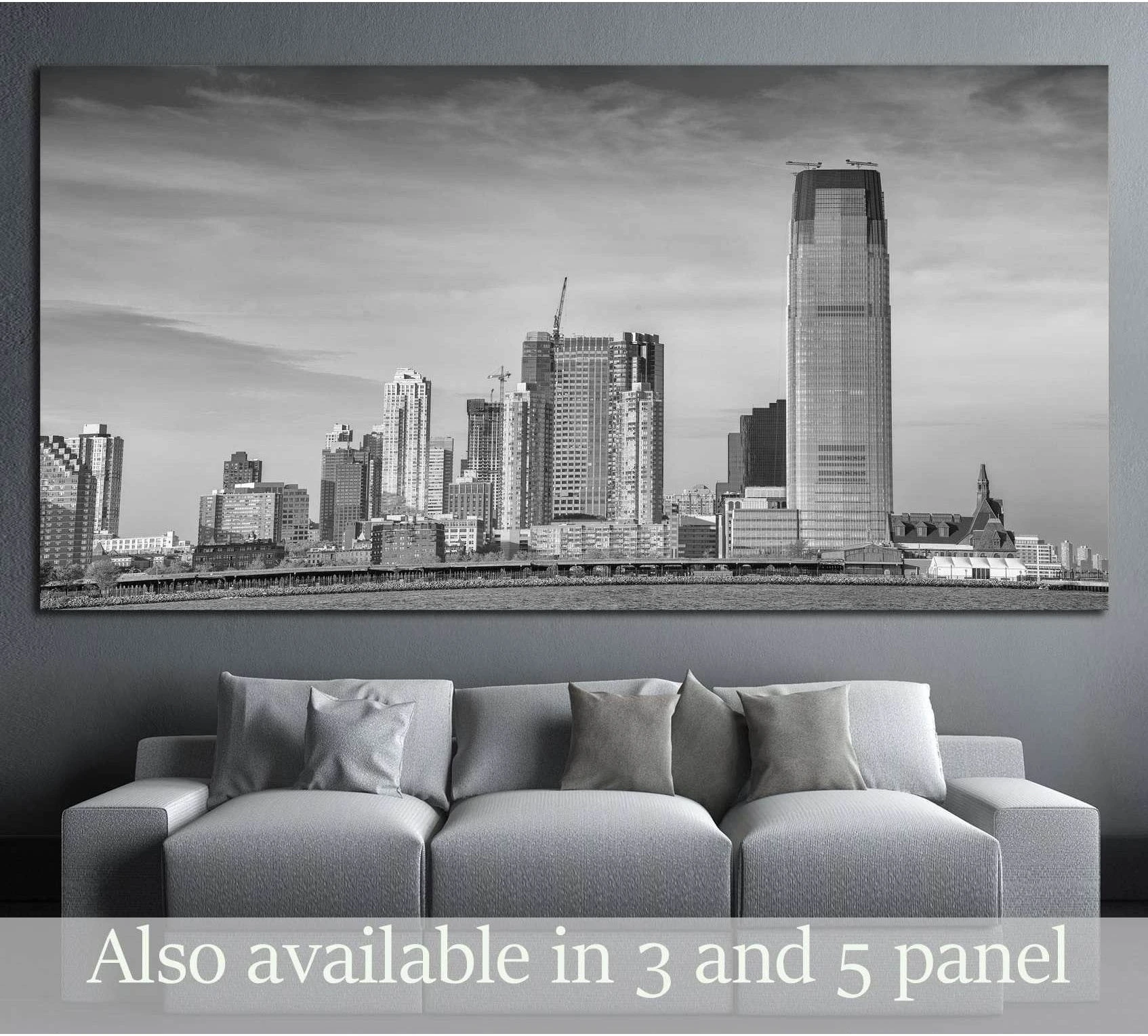 Black and white Jersey City skyline canvas print hung above a gray sofa in a modern living room