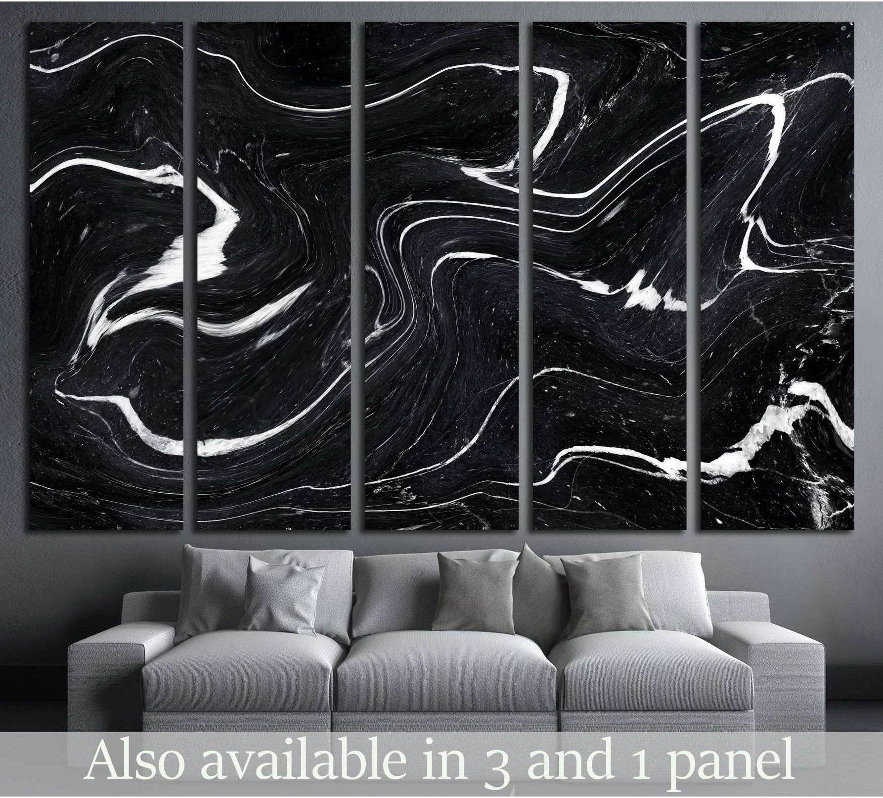 Black marble abstract canvas print with flowing white wave lines above a gray sofa