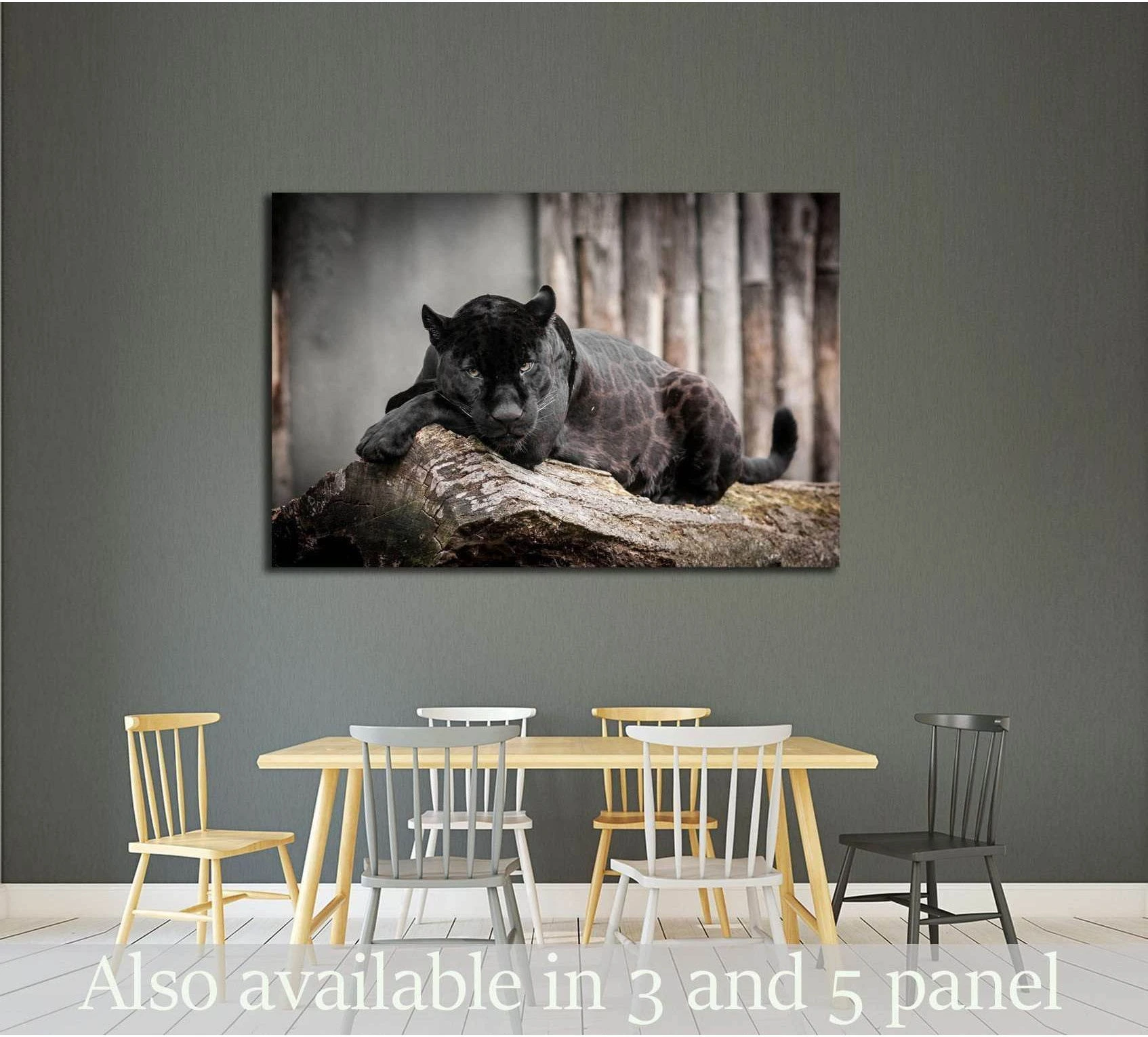 Black panther canvas print resting on a tree log, displayed above a dining table in a modern neutral room