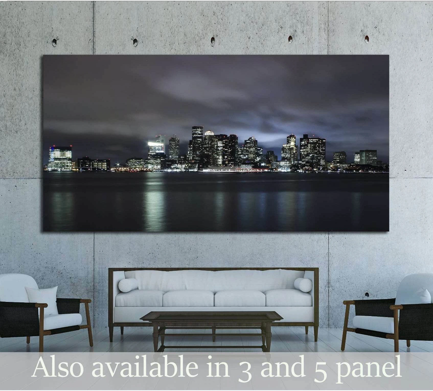 Boston skyline canvas print at night with dark waterfront reflections, hung above a sofa in a modern living room