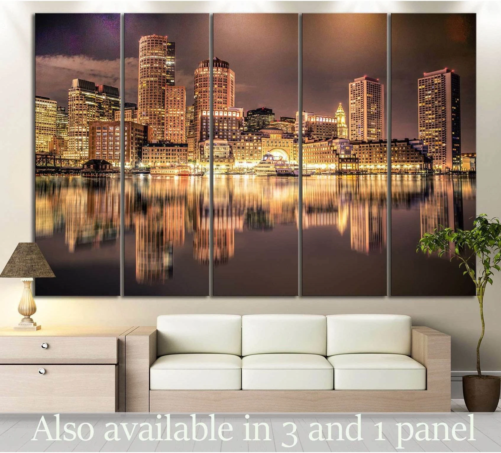 Boston skyline canvas print with glowing night city lights and harbor reflections above a sofa