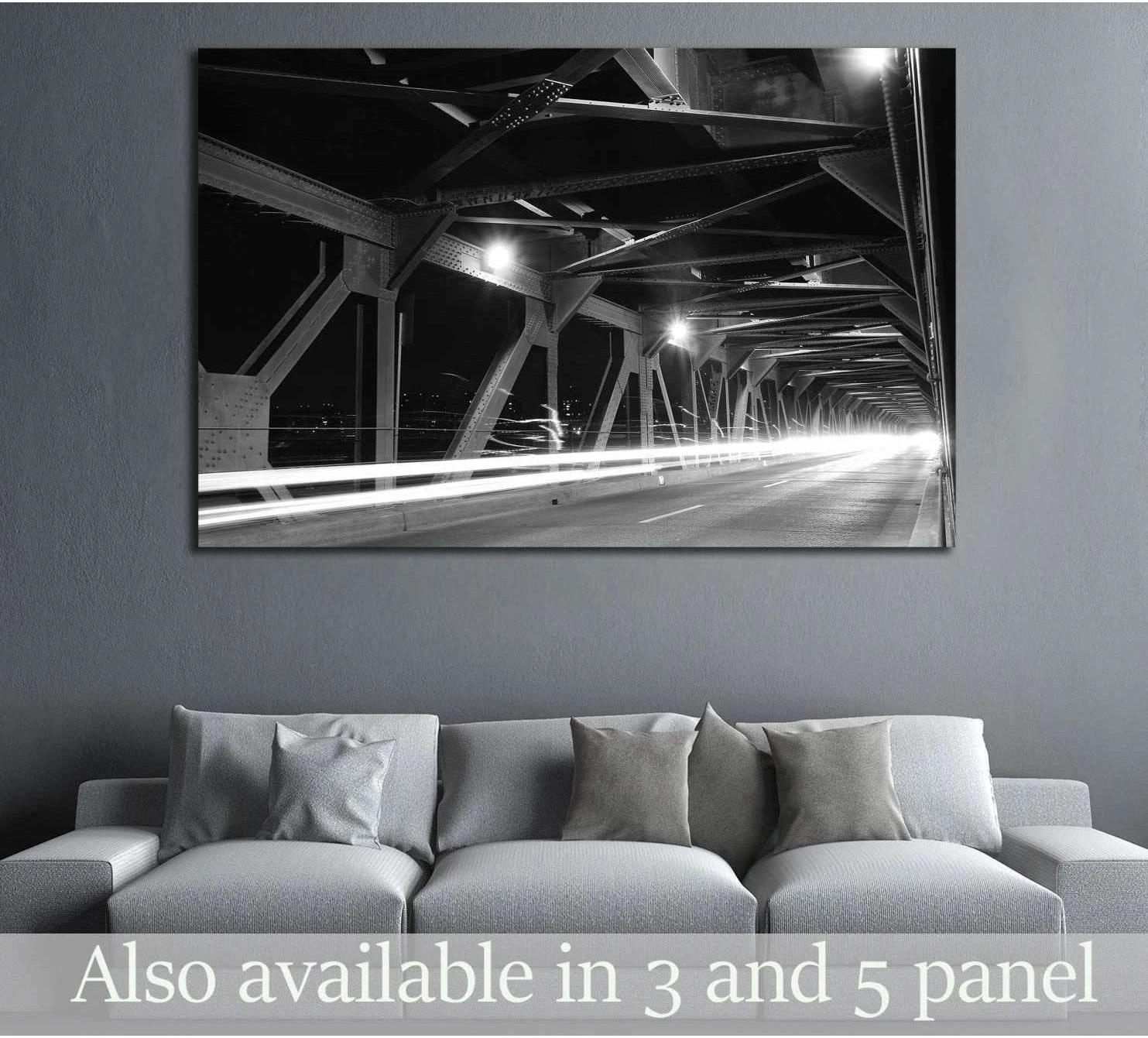 Black and white Edmonton bridge canvas print with long-exposure light trails above a gray sofa