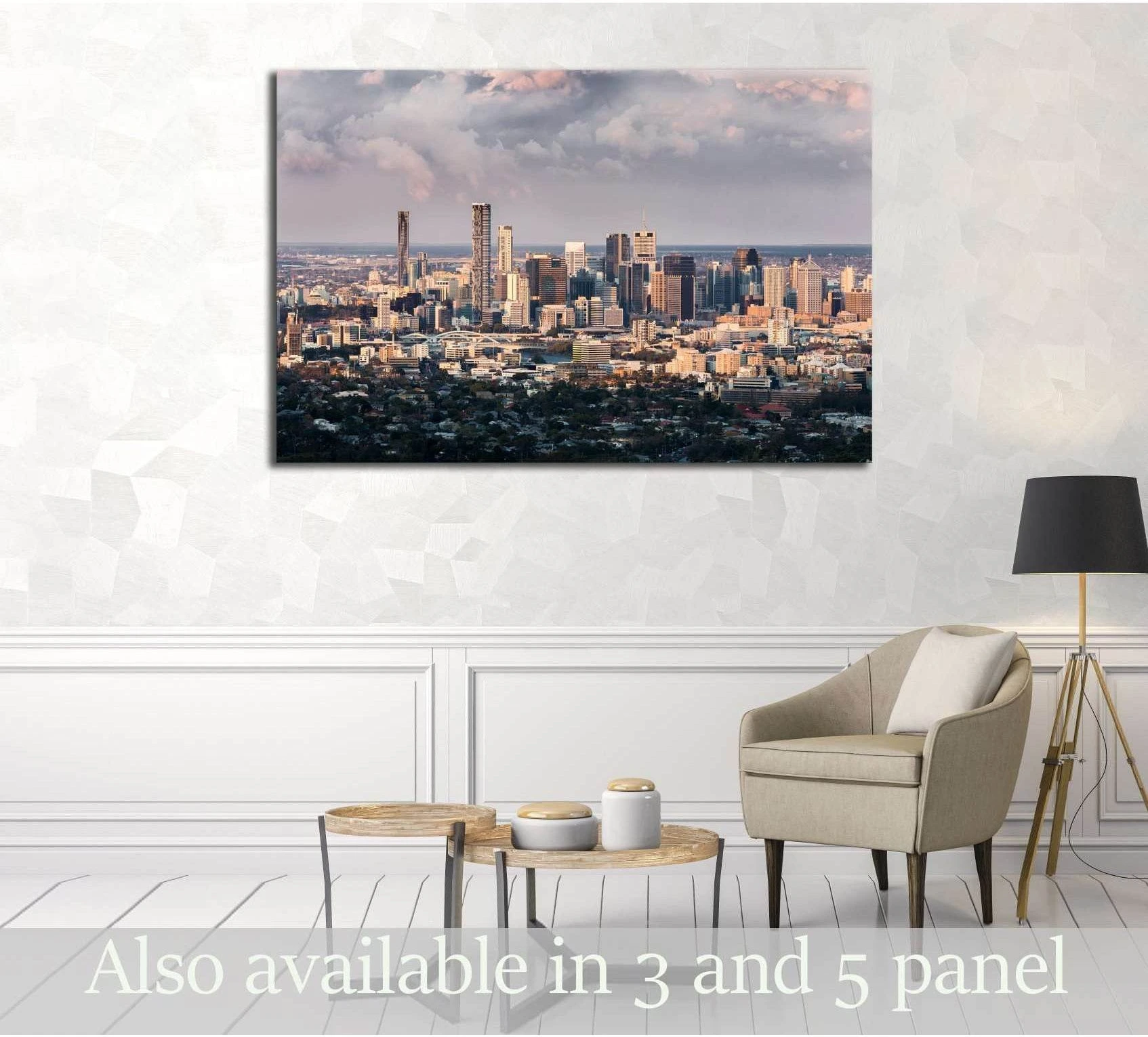 Brisbane skyline canvas print with warm sunset clouds displayed above chairs in a modern living room