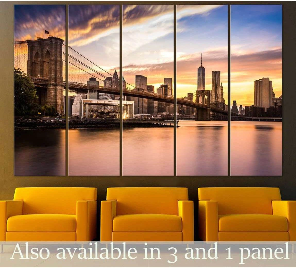 Brooklyn Bridge sunset canvas print with Manhattan skyline hung above yellow chairs in a modern waiting area