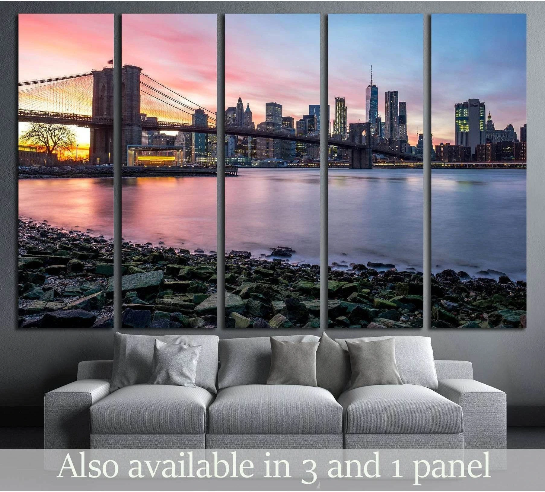 Brooklyn Bridge sunset canvas print with downtown Manhattan skyline above a sofa in a modern living room