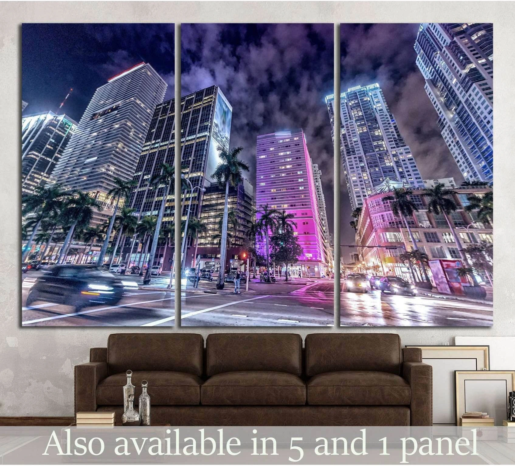 Downtown Miami skyline triptych canvas print with neon-lit towers above a sofa