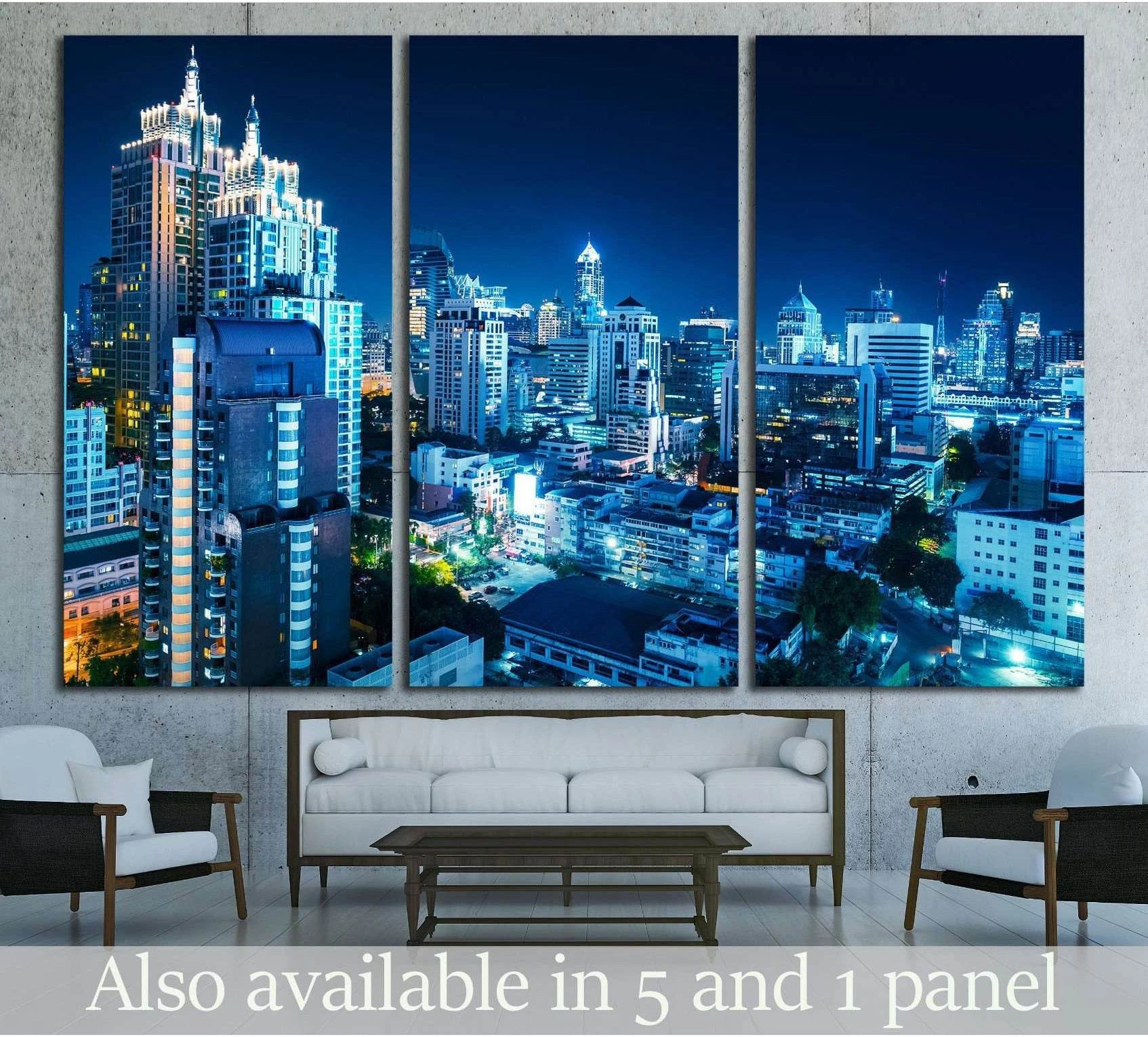 Bangkok skyline triptych canvas print at night in cool blue tones above a sofa in a modern living room